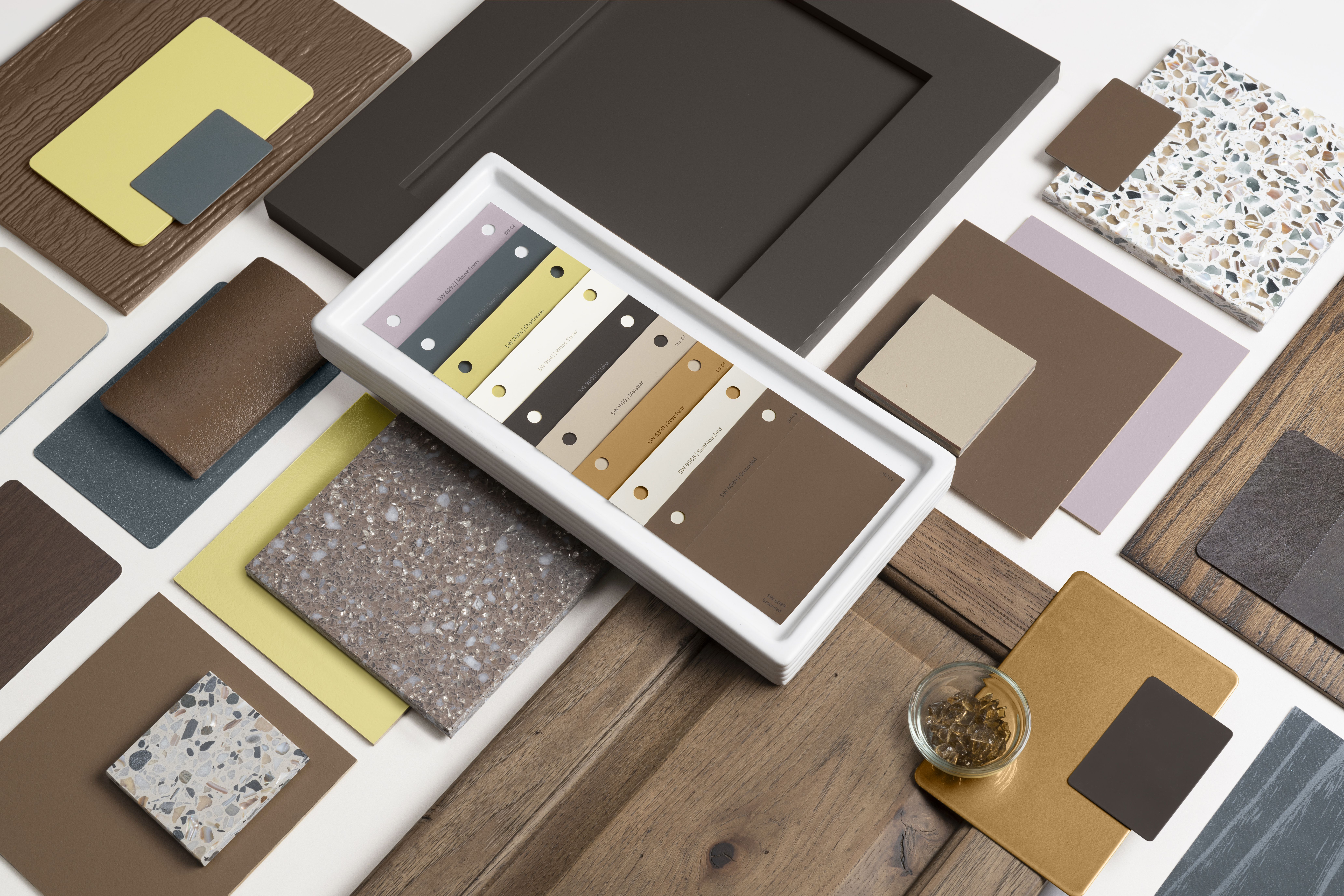 A selection of paint samples and swatches taken from Sherwin Williams Color Capsule of the Year for 2025