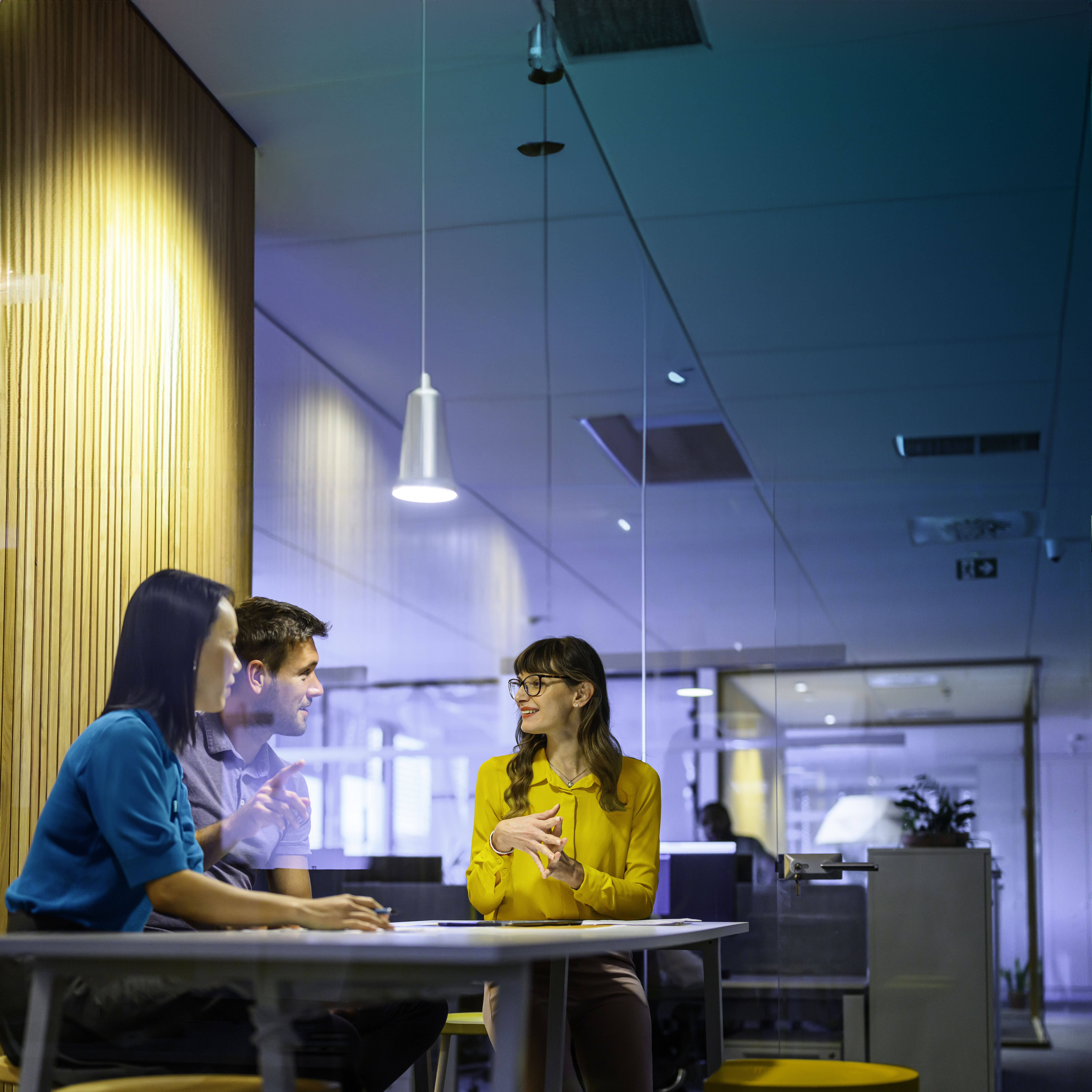 Business meeting between three colleagues square