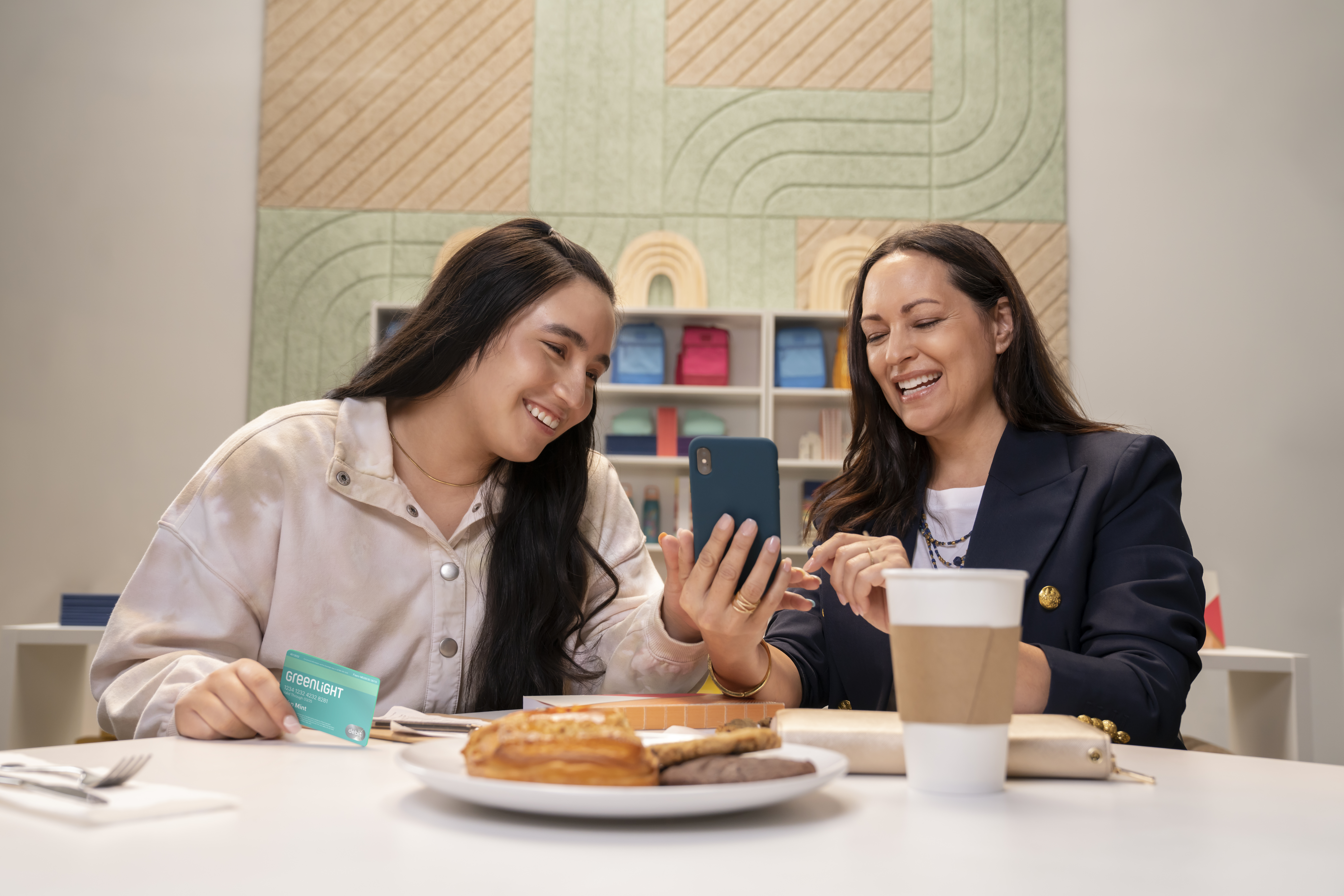 Mother and daughter looking at GL app