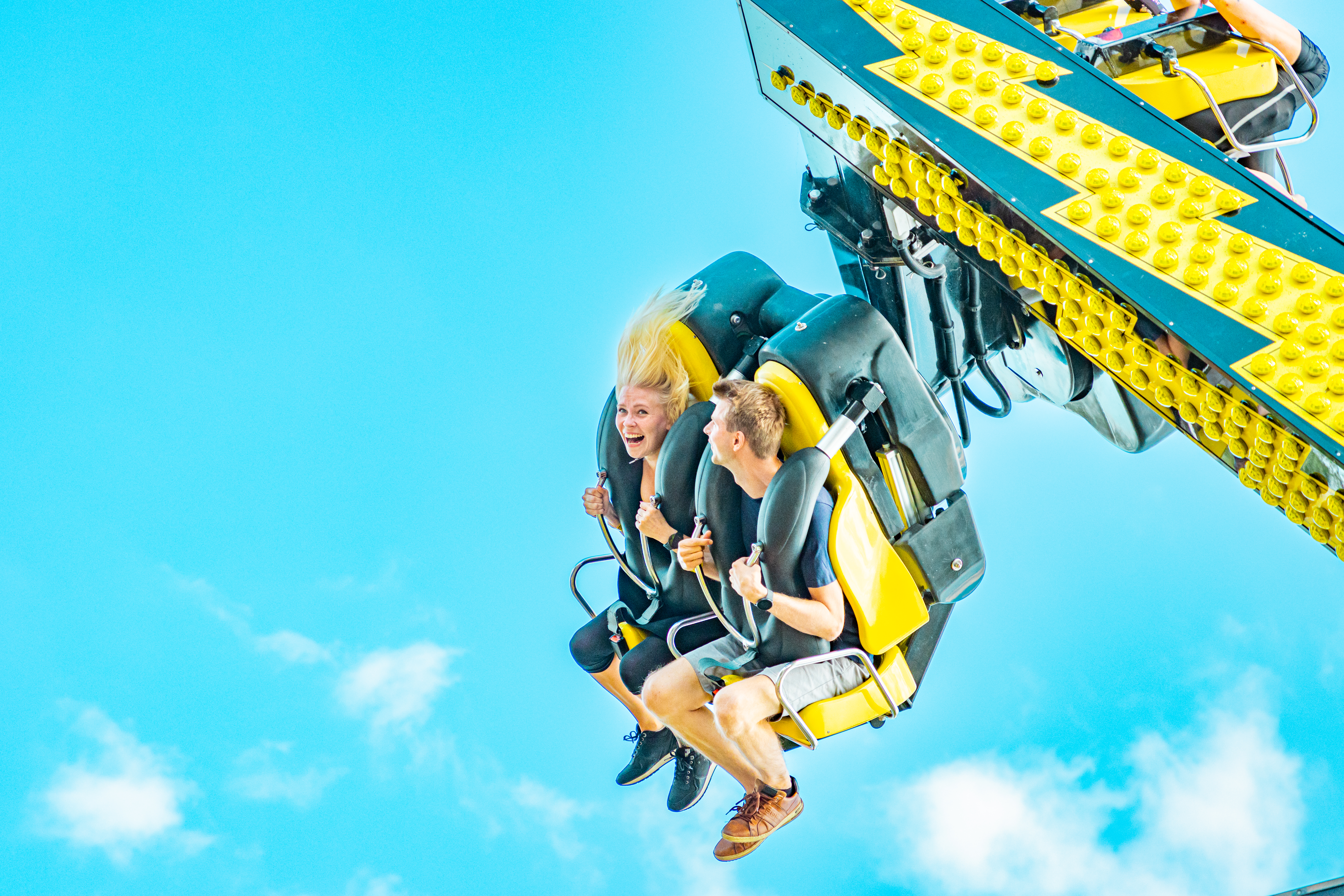 Woman and man riding High Voltage ride