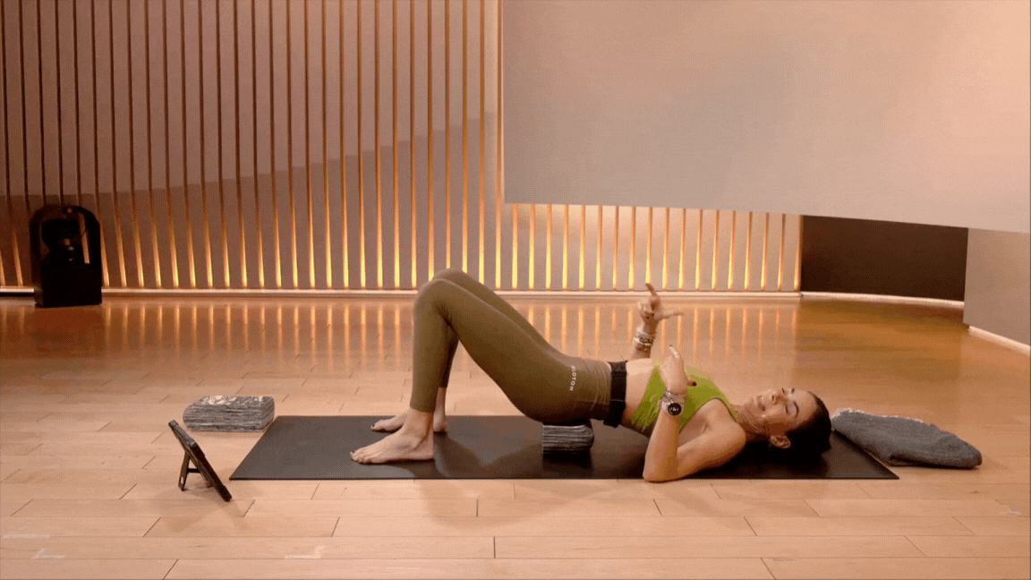 Mariana Fernandez modified bridge pose with block
