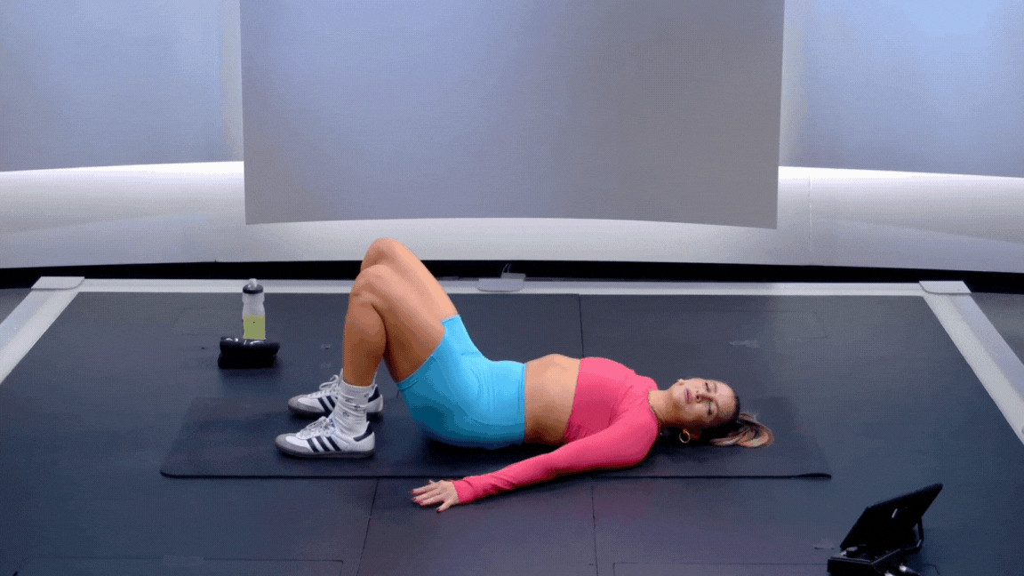 Peloton instructor Camila Ramón demonstrating a hip bridge with proper form as a great beginner bodyweight exercise