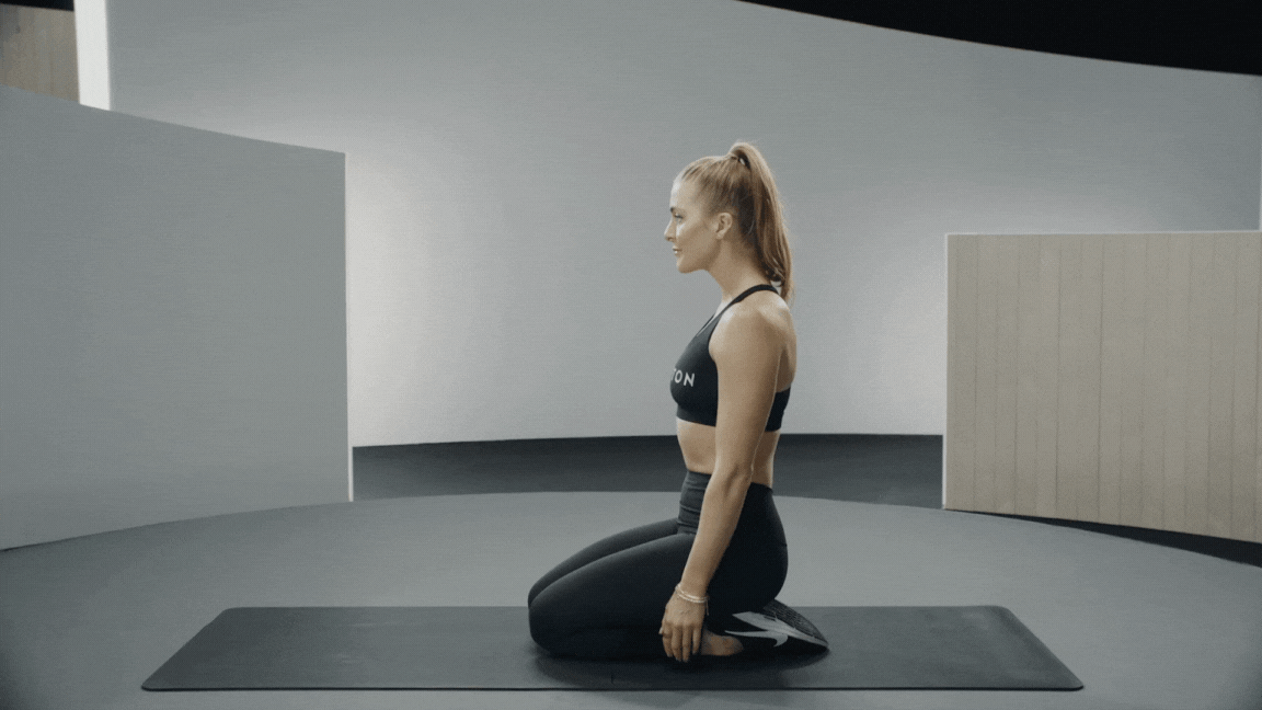 Rebecca Kennedy demonstrates a plank march exercise 