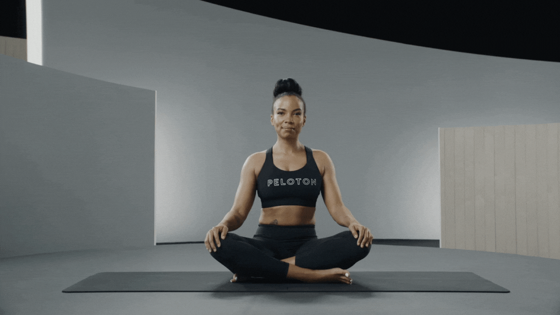 Peloton instructor Chelsea Jackson Roberts demonstrating the Bound Angle Pose seated yoga posture