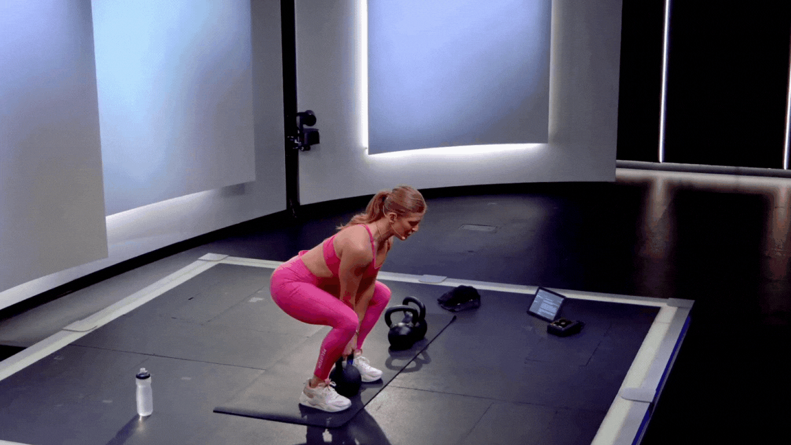 Peloton instructor Rebecca Kennedy demonstrates a kettlebell deadlift back exercise.