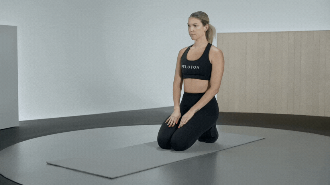 Peloton instructor Callie Gullickson demonstrates a hip CAR warm-up exercise.