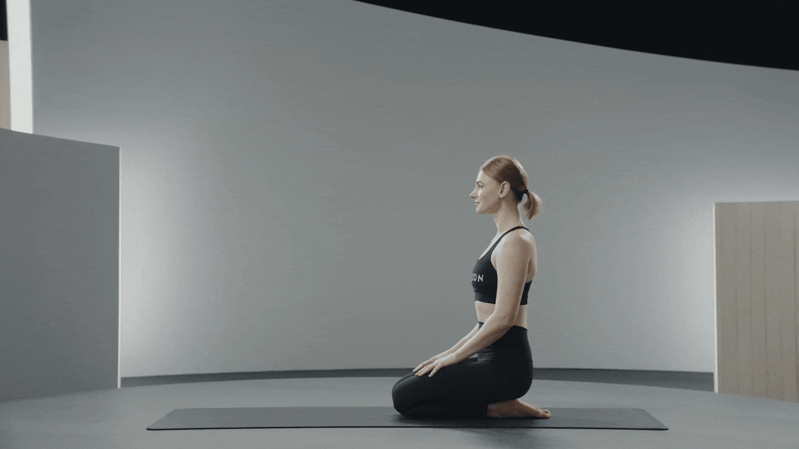 Woman demonstrating Flying Pigeon Pose