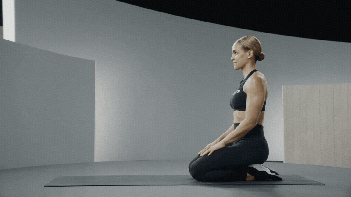 Peloton instructor Jess Sims demonstrates a forearm plank isometric exercise with proper form