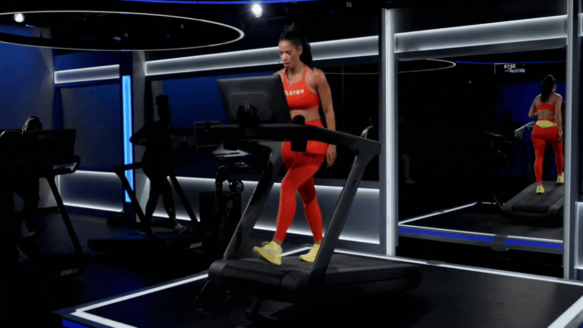 Peloton instructor Kirsten Ferguson does an incline treadmill walk workout warm-up during a Peloton treadmill class.