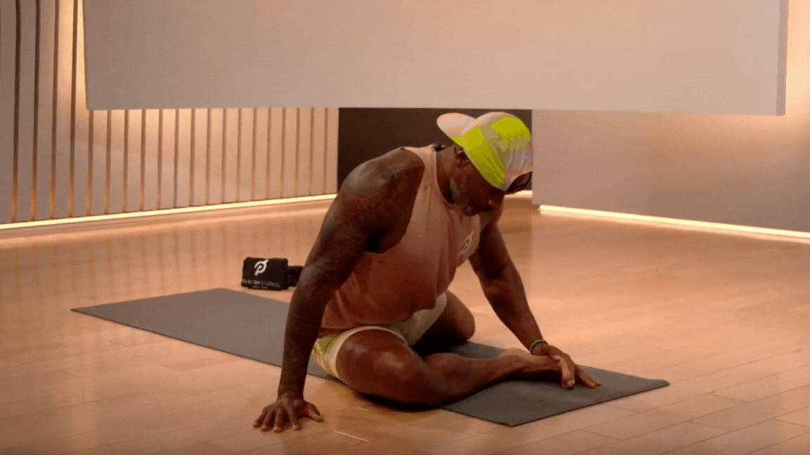 GIF of Adrian Williams doing Pigeon Pose 