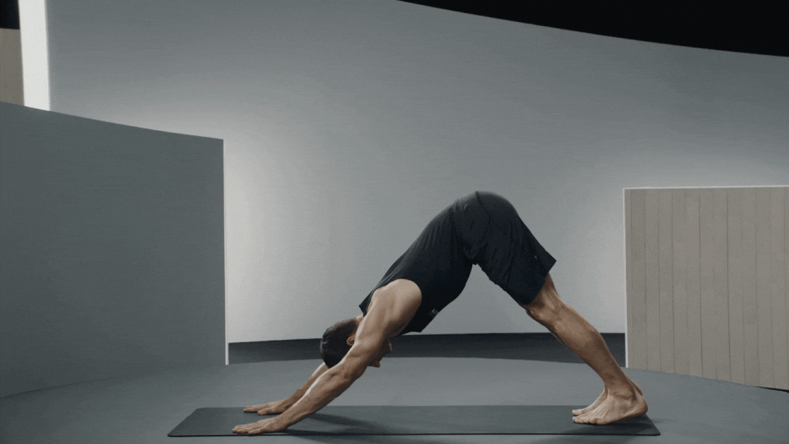 Peloton instructor Denis Morton demonstrates Revolved Low Lunge Pose as part of a pre-run yoga flow