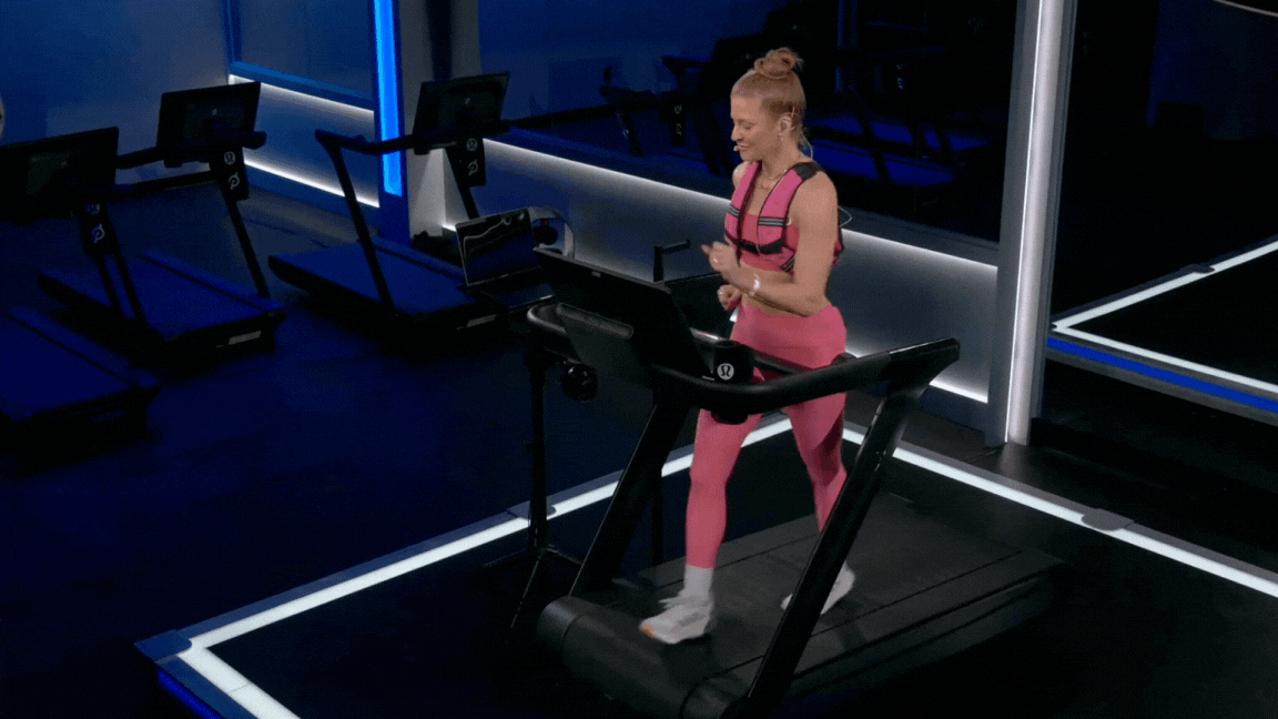 Peloton instructor Rebecca Kennedy leads a weighted vest hike class while walking in a weighted vest on the Peloton Tread+.