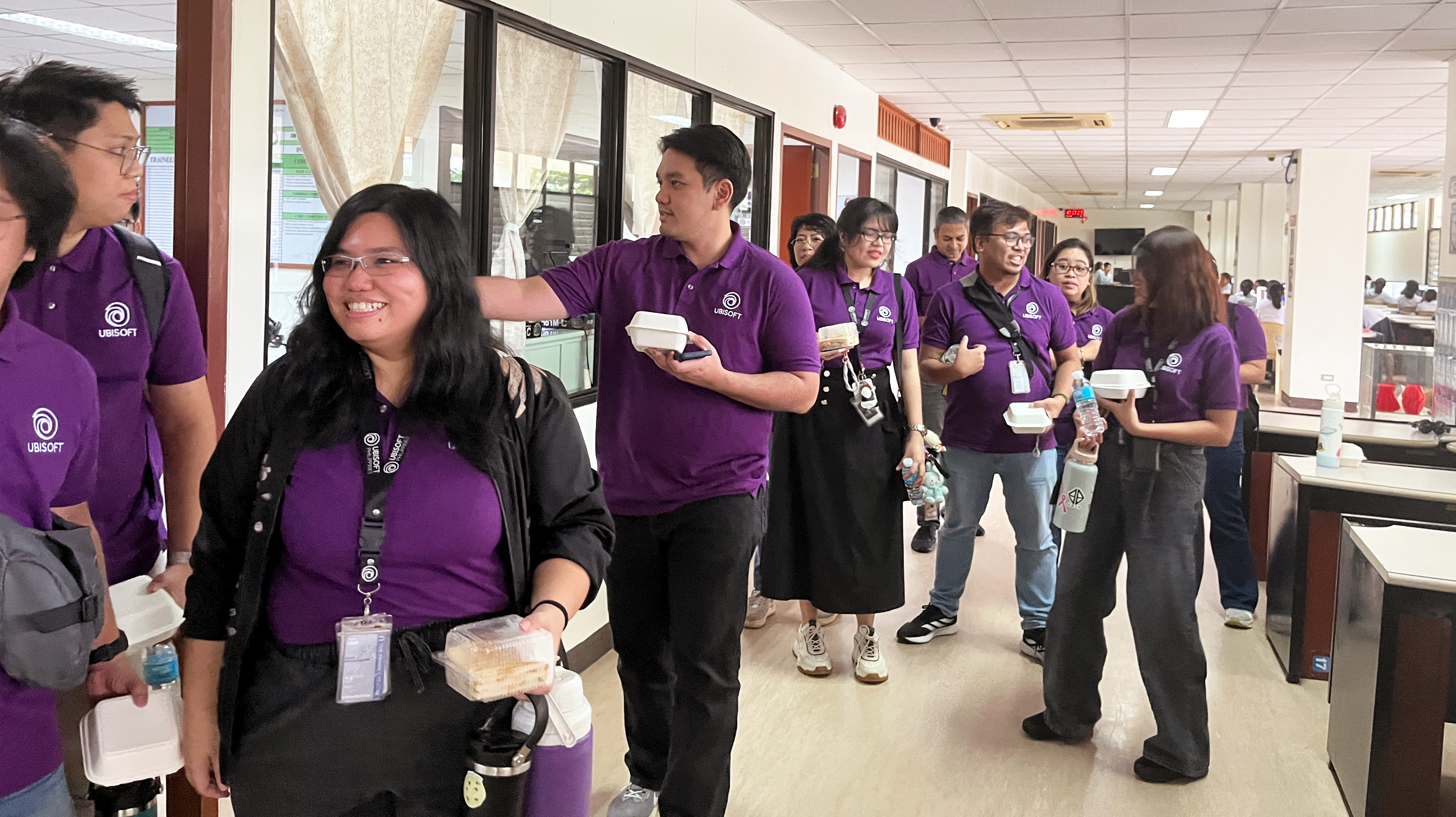 ubisoft team members walking down a class room