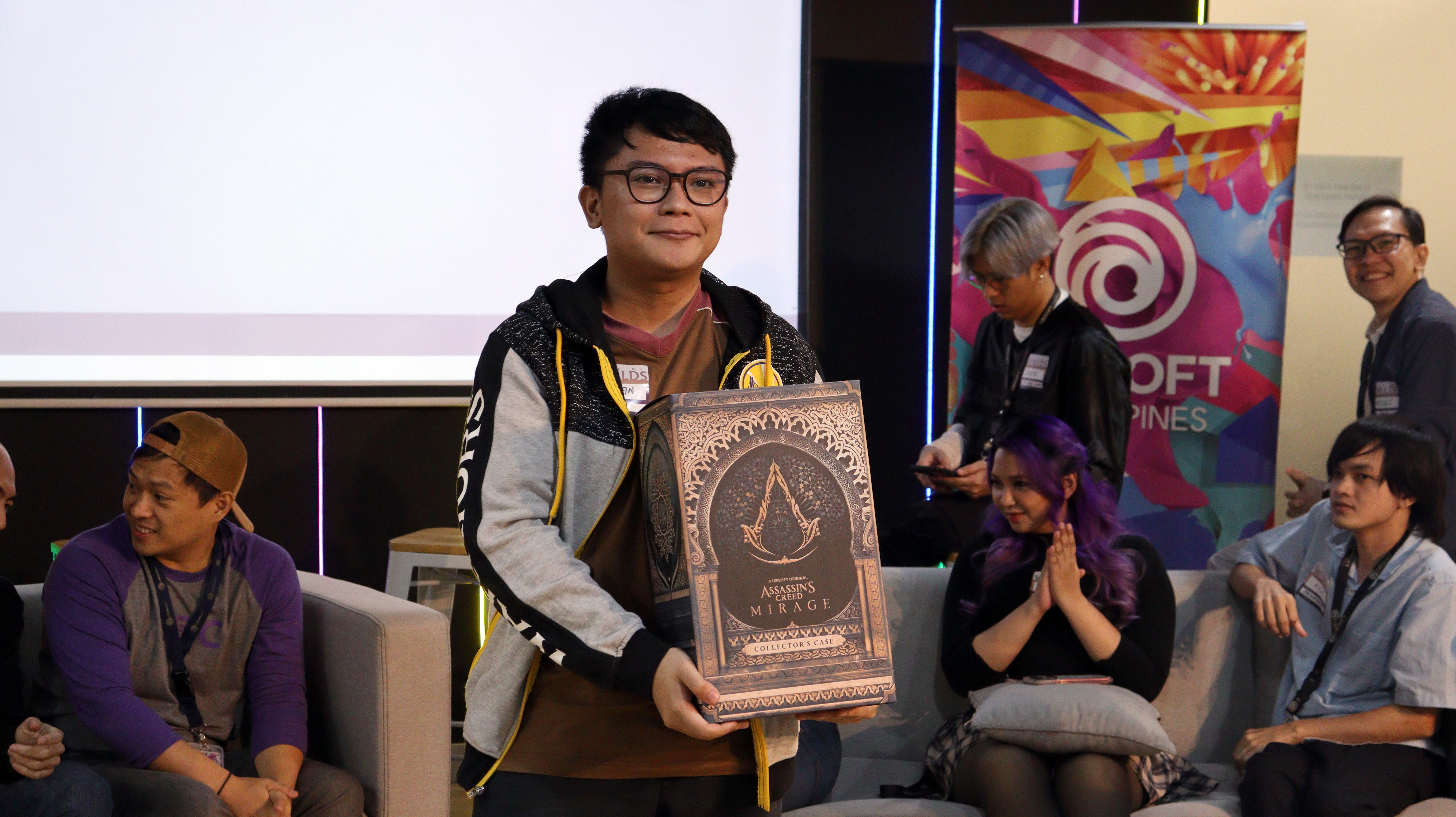 participant showing an assassin's creed collector case