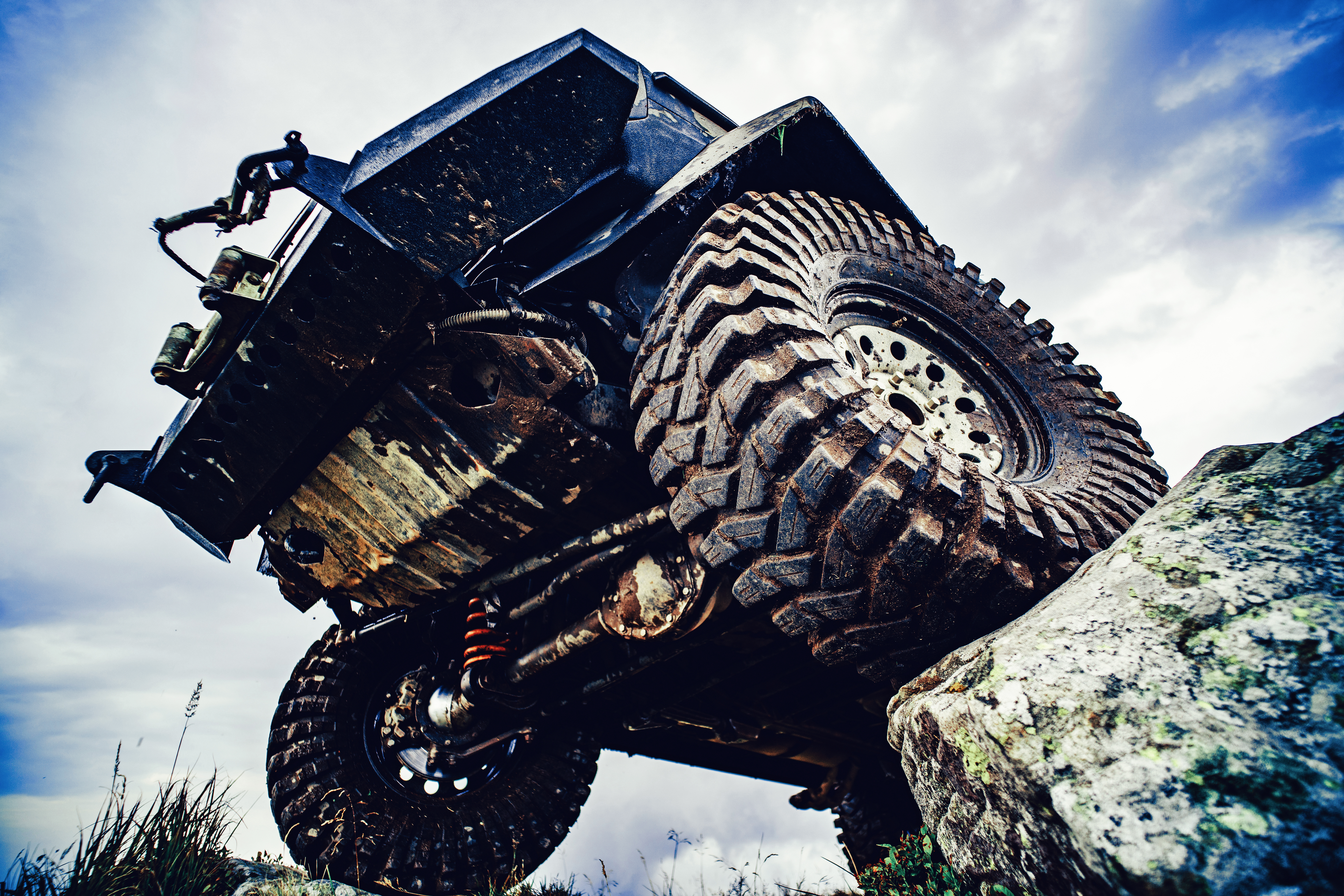 Under an off road vehicle on a mountain road