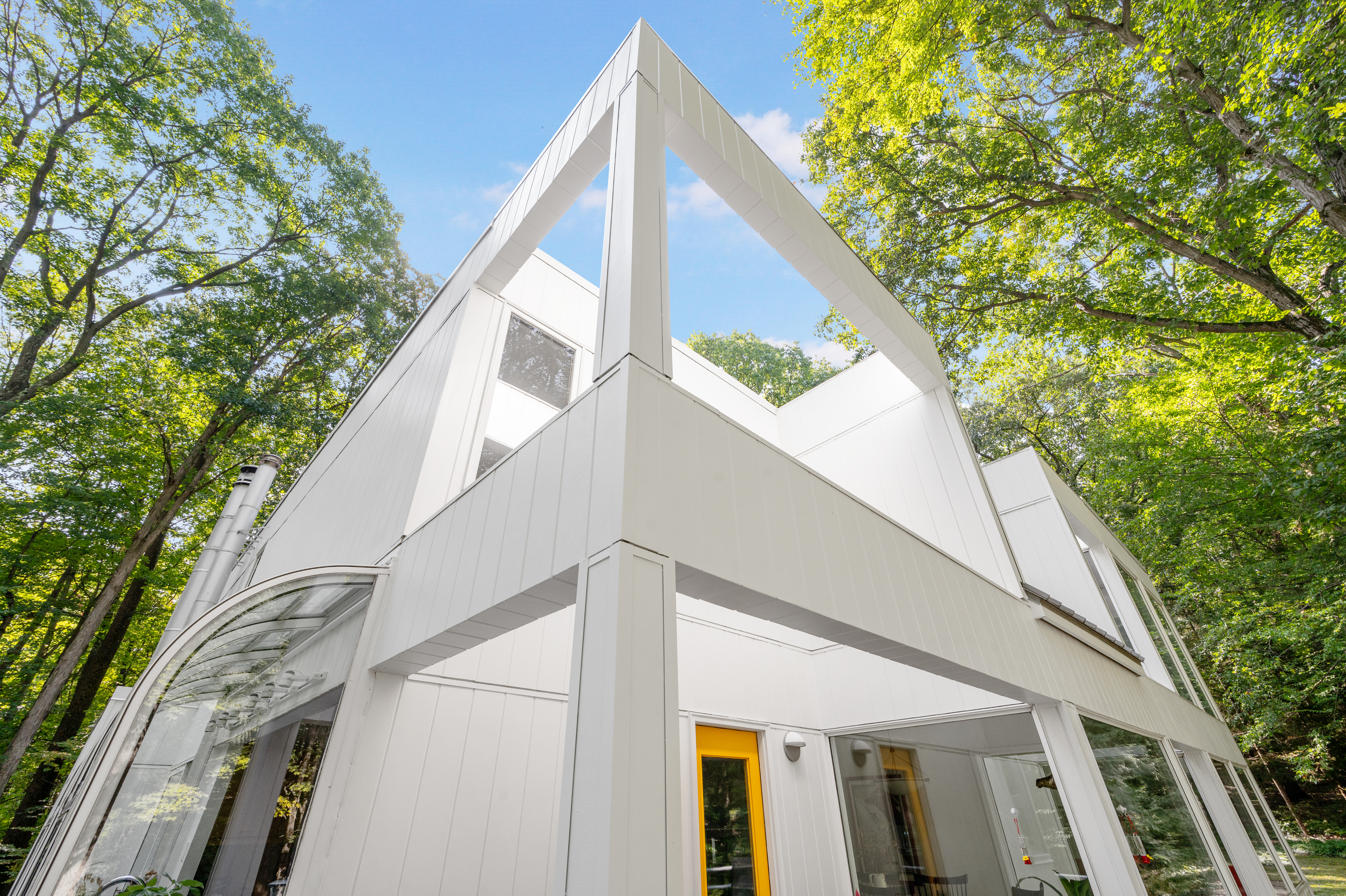 Ultra modern house with open concept details, clad in Hardie® Artisan® V-Groove and Hardie trim in Arctic White