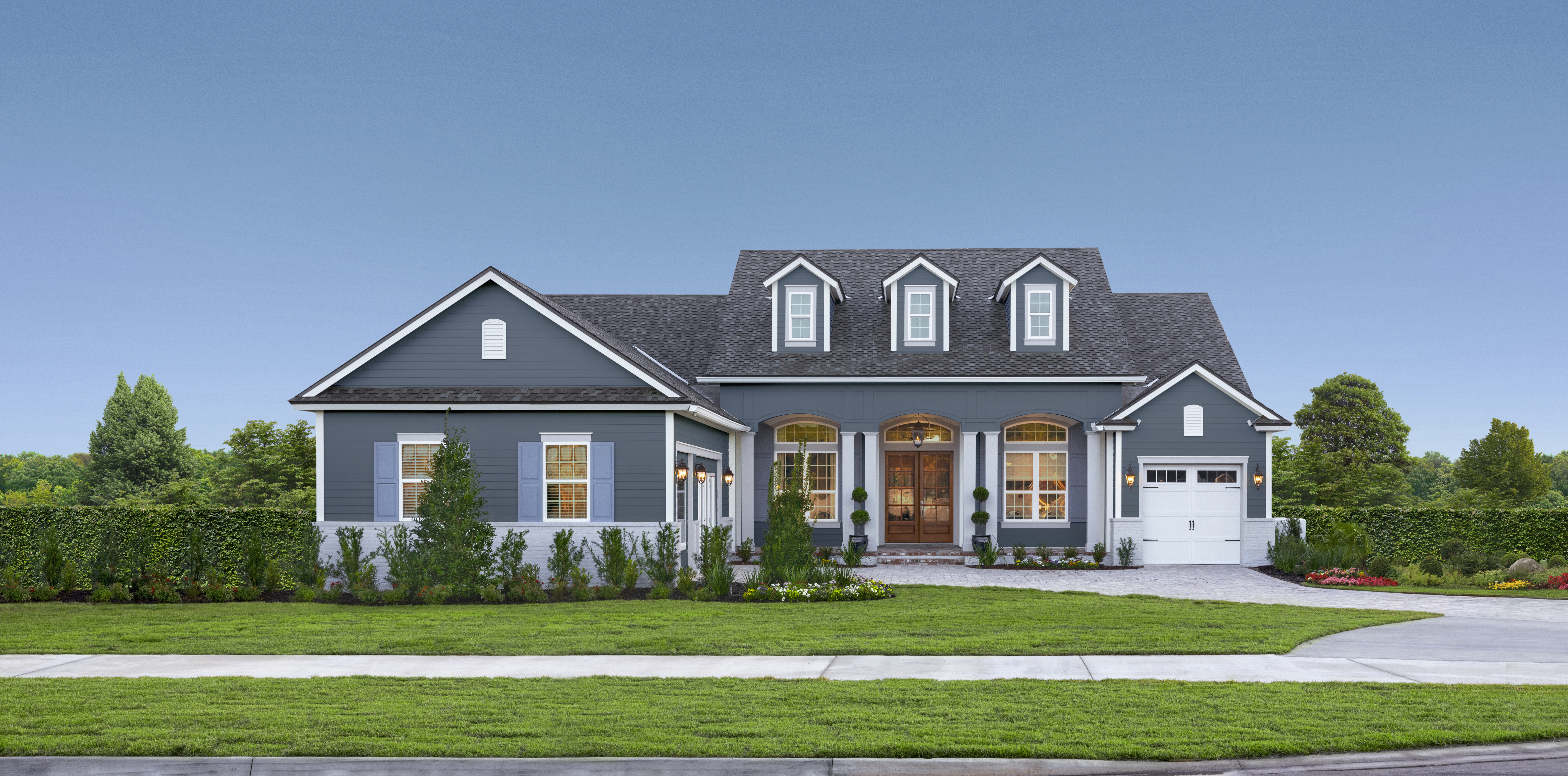 A large, modern interpretation of the Cape Cod home in Evening Blue Plank lap siding