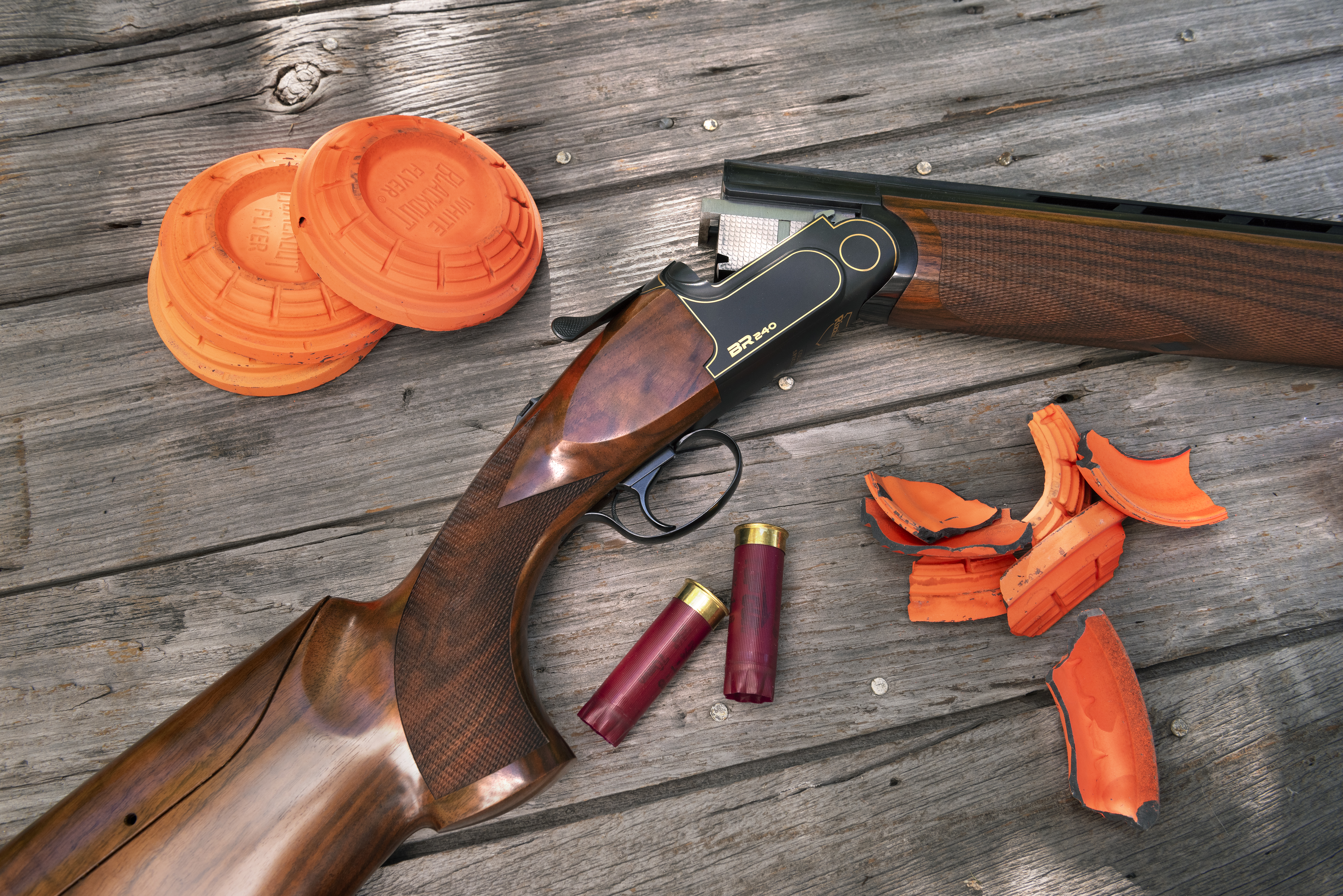 The Rizzini BR 240 Cole Special Sporting on a wood surface with clay birds. 