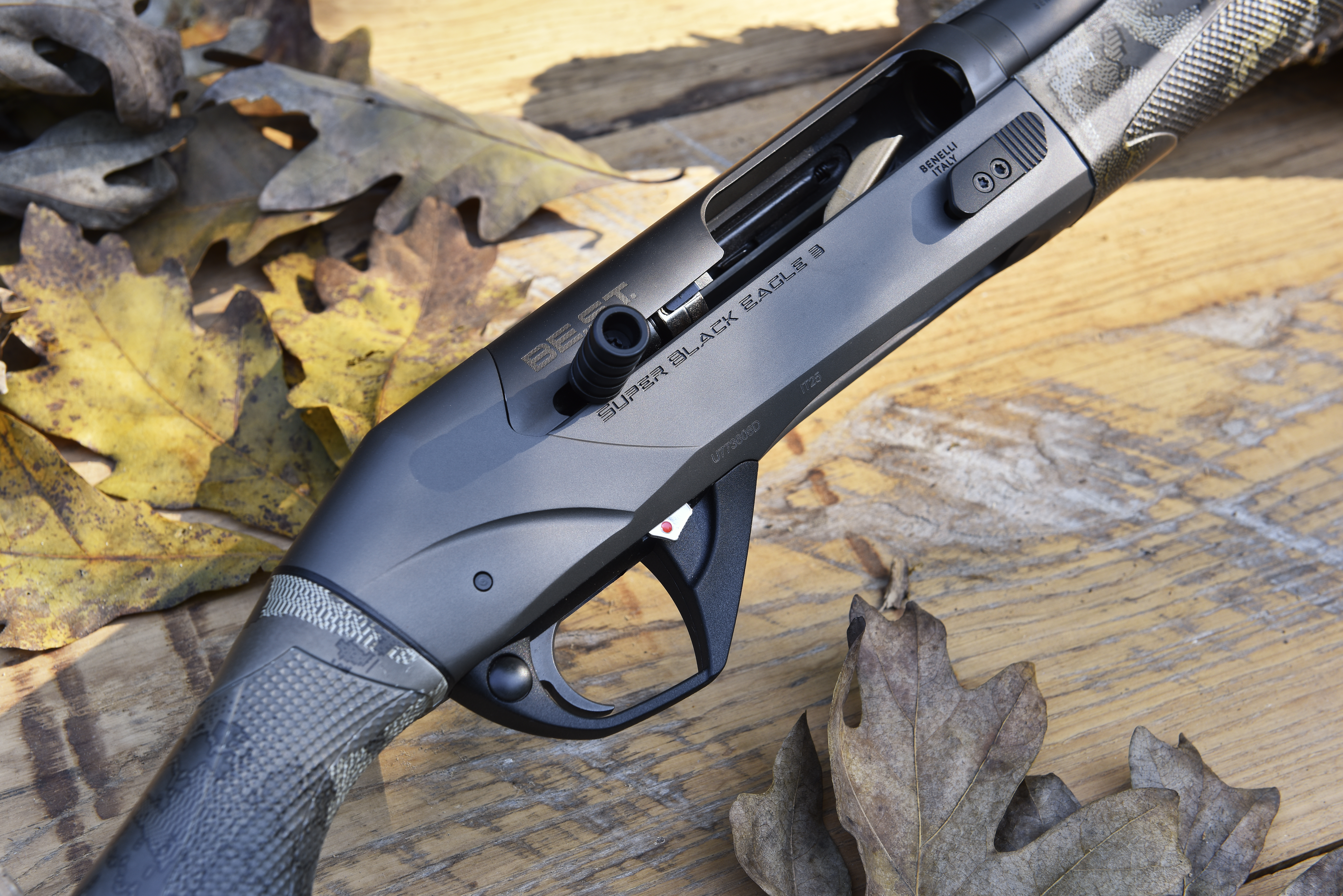 Closeup photo of Benelli SBE 3 A.I. BES.T. shogun on barn boards with leaves.