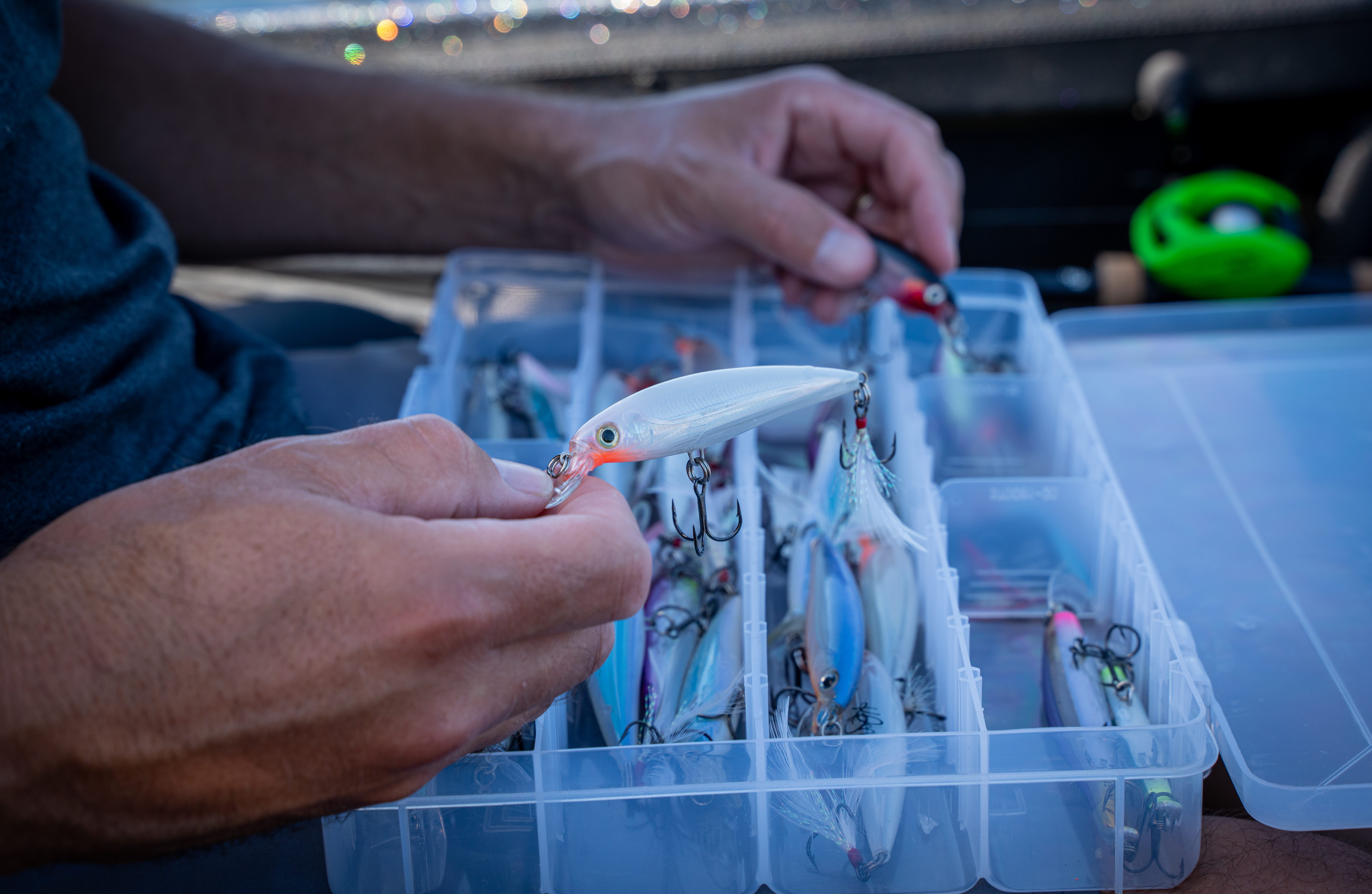 Hand holding jerk bait lure