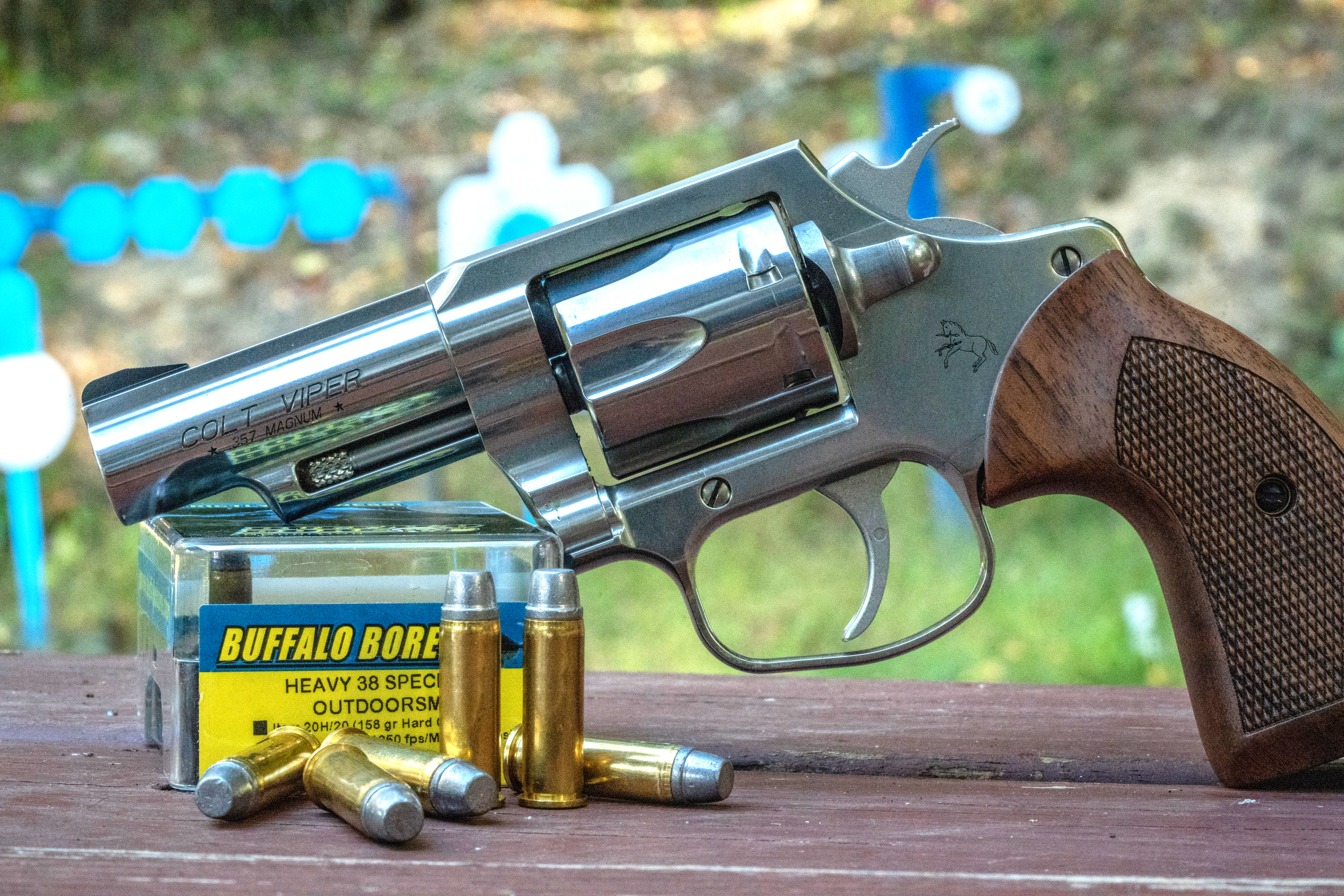 The new Colt Viper revolver on a bench with 38 Special ammo. 