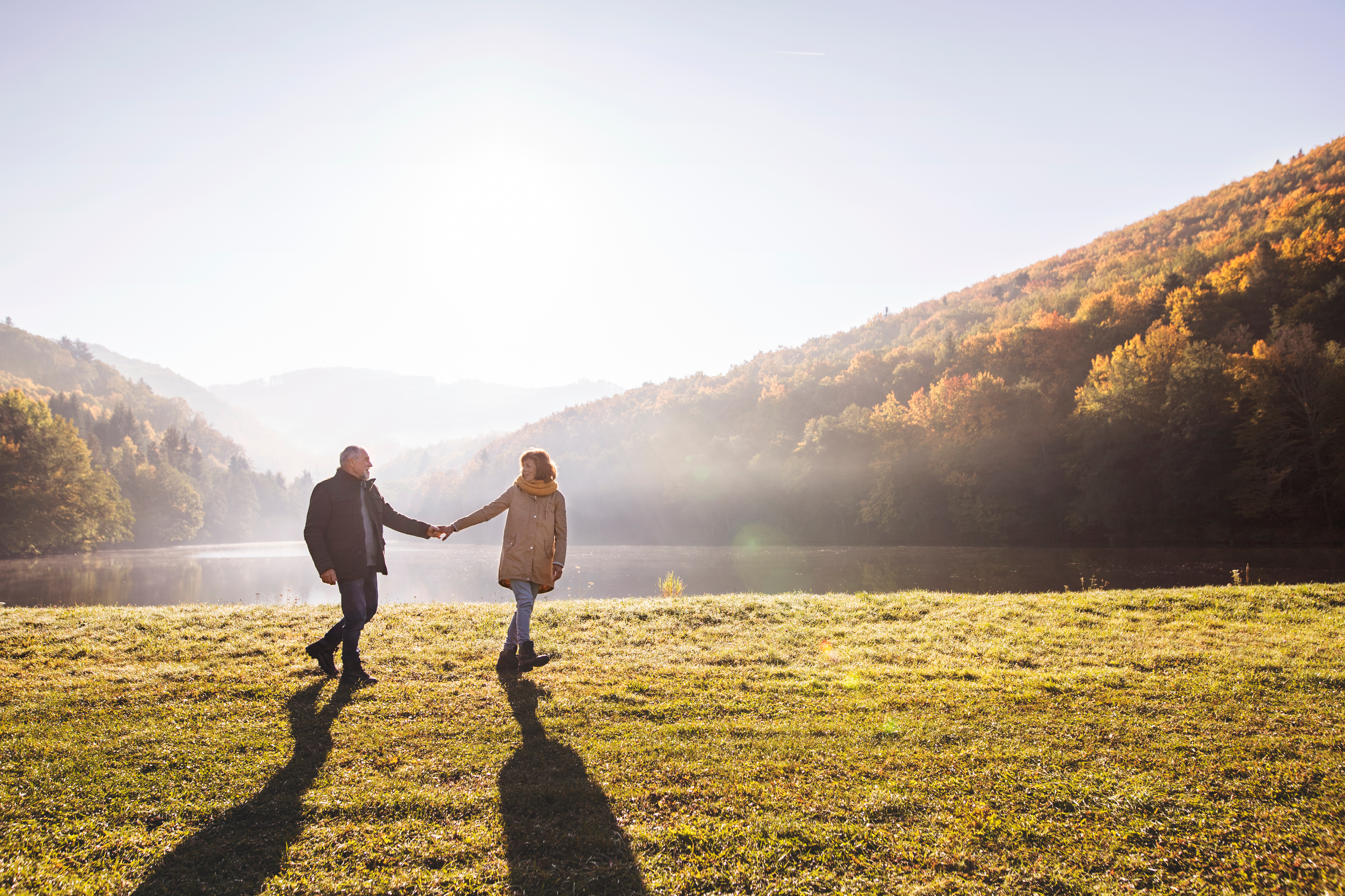 Senior couple on a walk in an autumn nature.
