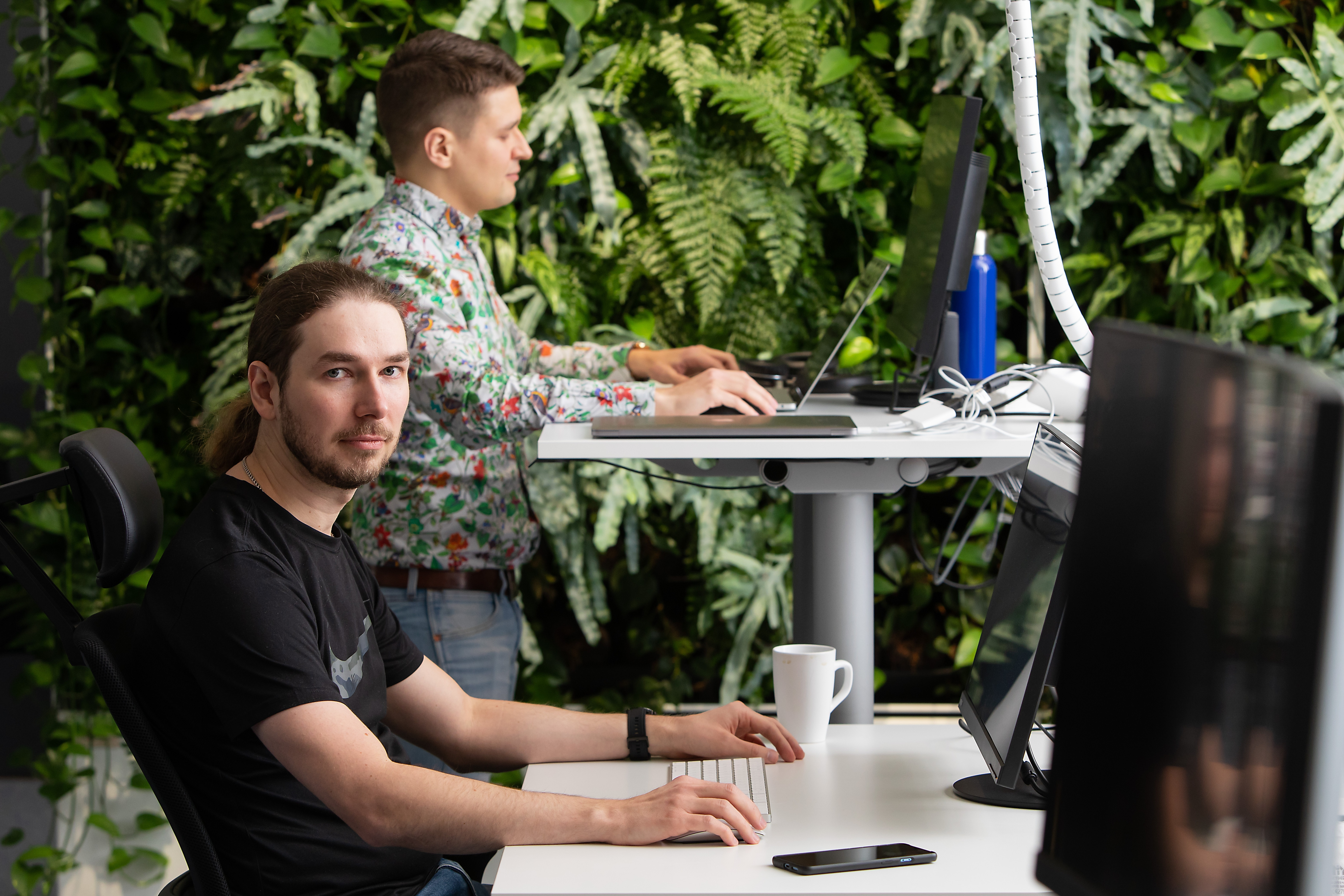 Insta employees at the office, plants, computers, plants