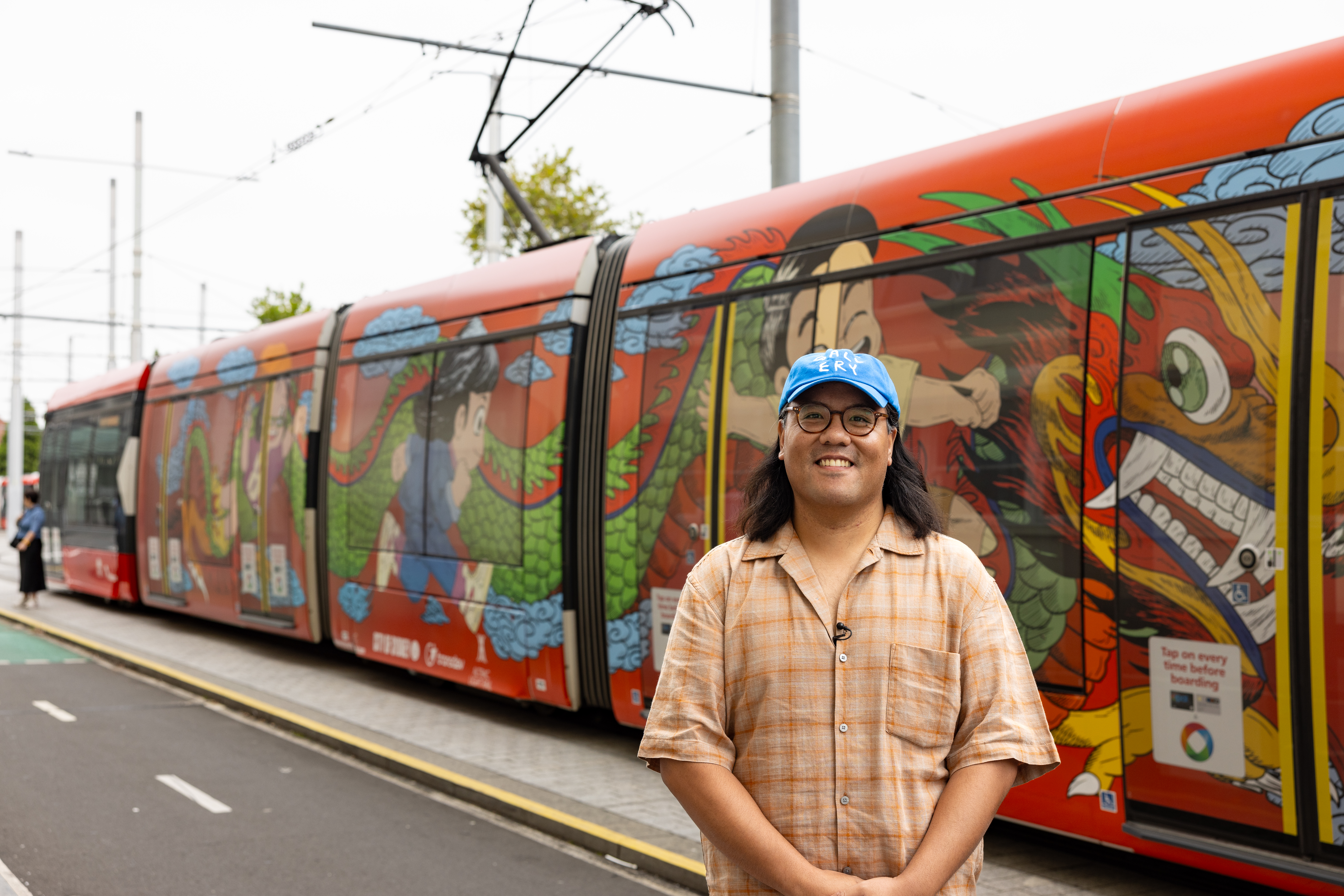 Artist Andrew Yee with his creation at Central Chalmers tram stop. Image: City of Sydney/Chris Southwood