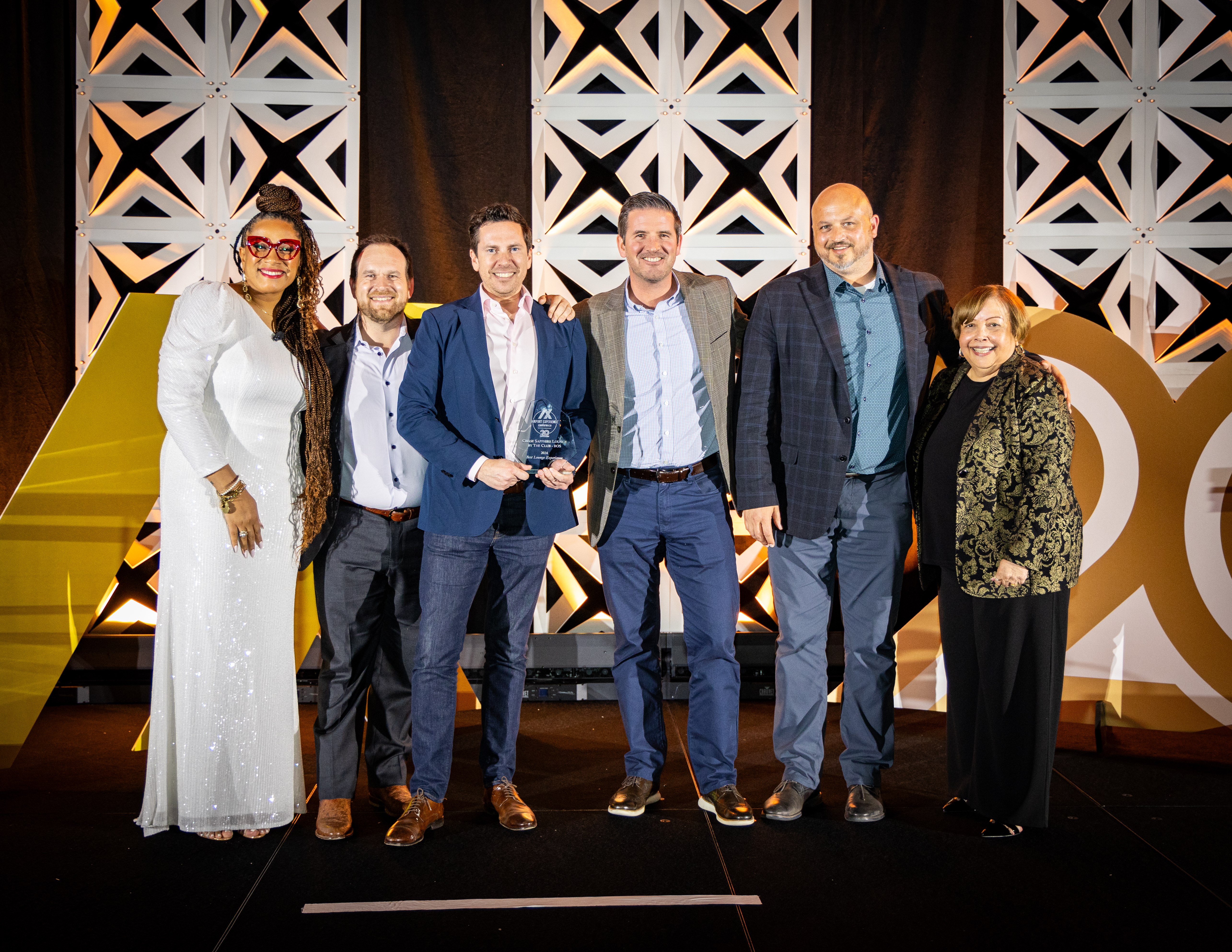 Awards ceremony, group of people posing with award