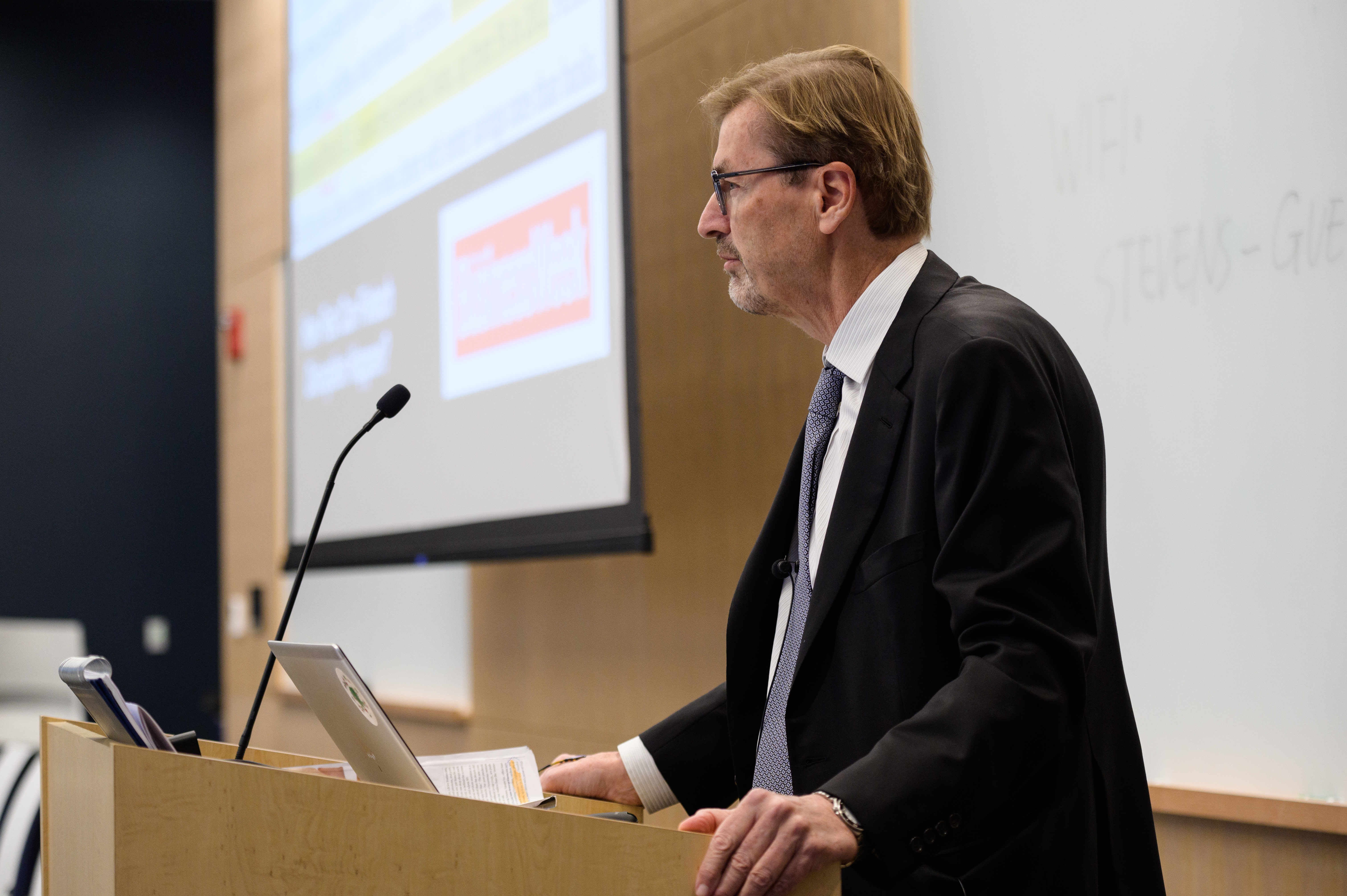 Male speaker at podium