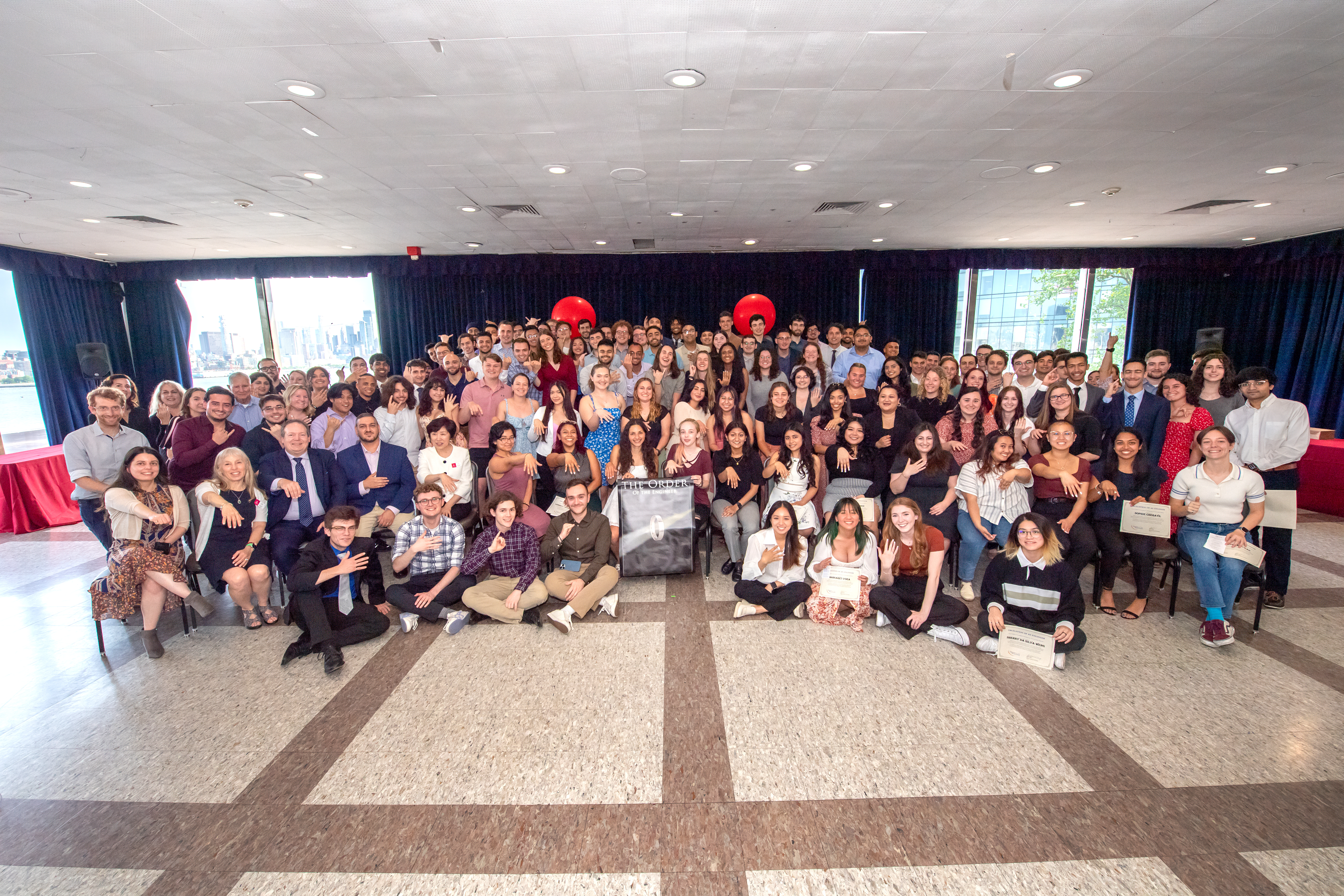 All inductees from the Order of the Engineer ceremony holding their hands up to display their rings