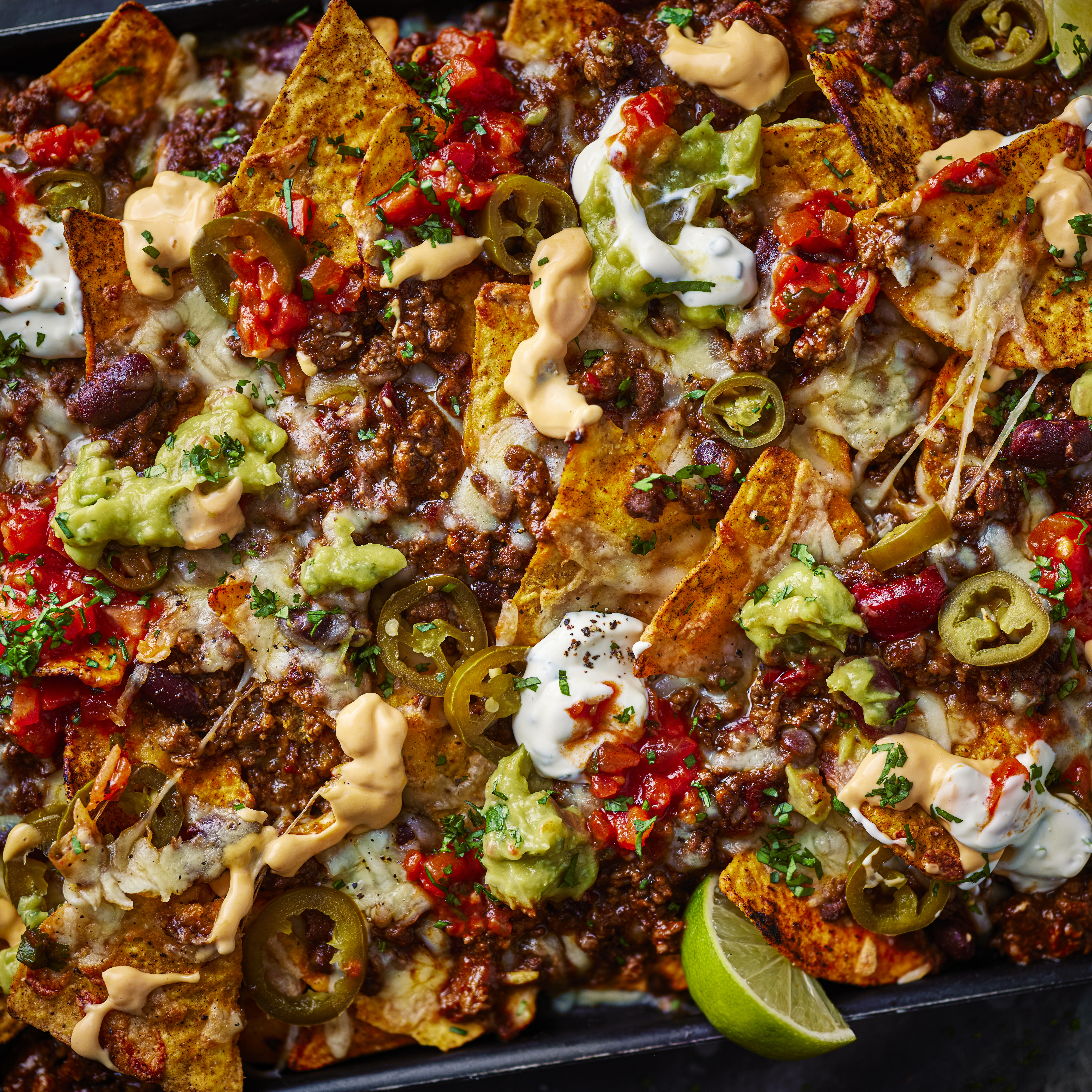 Close-up of beef chilli nachos on pan
