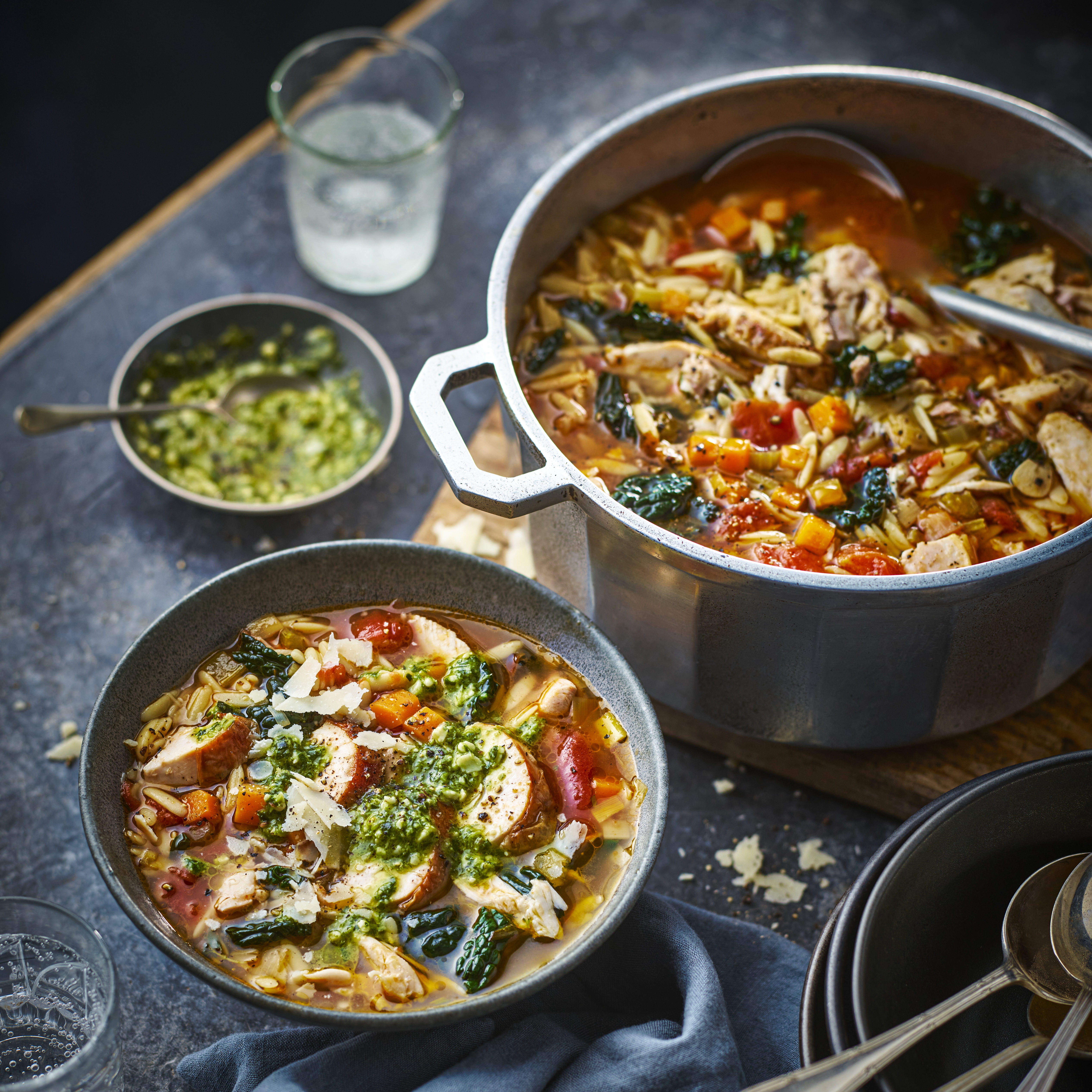 Chicken orzo soup in pot