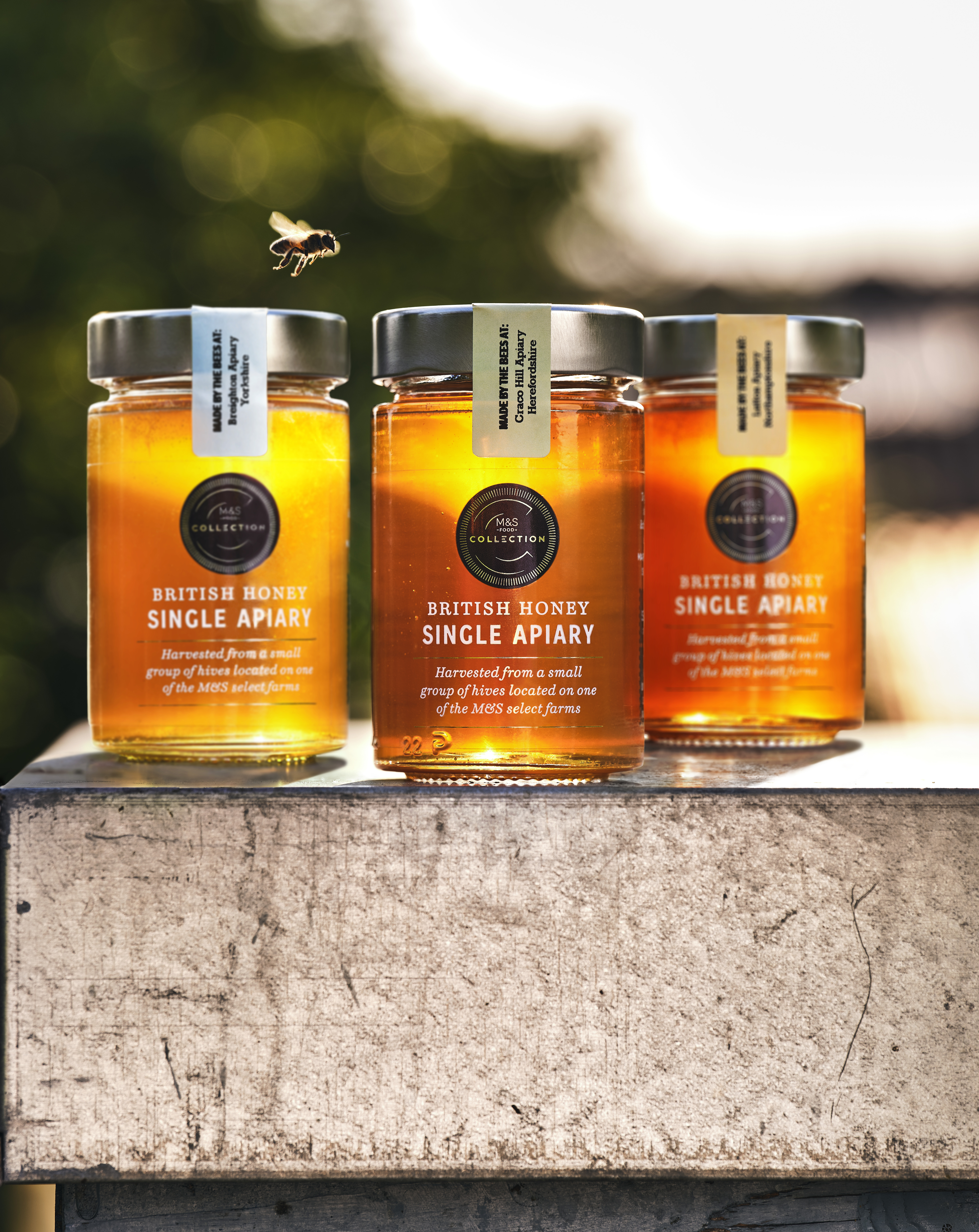 Three jars of honey on shelf