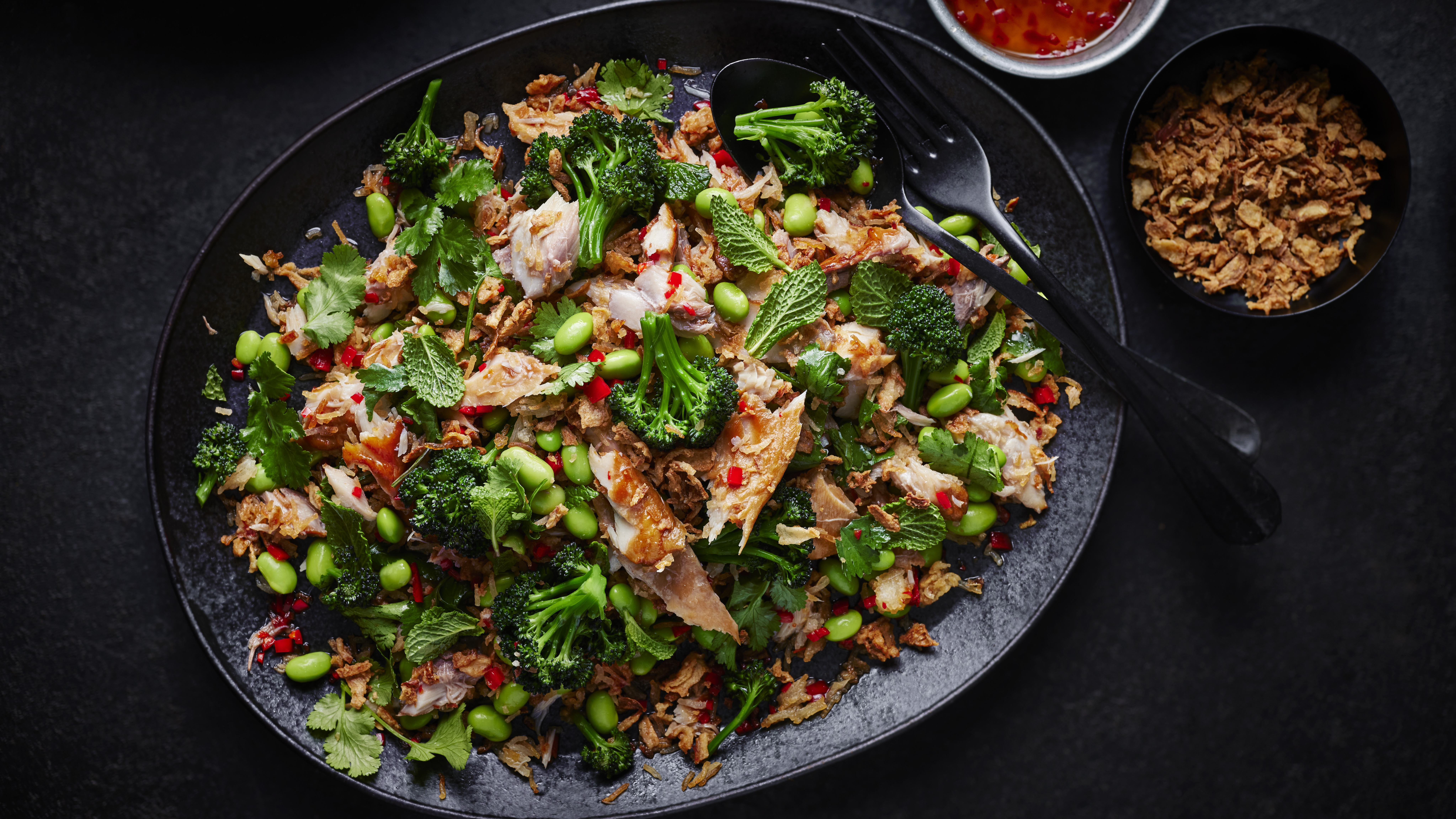 Smoked mackerel salad on black background