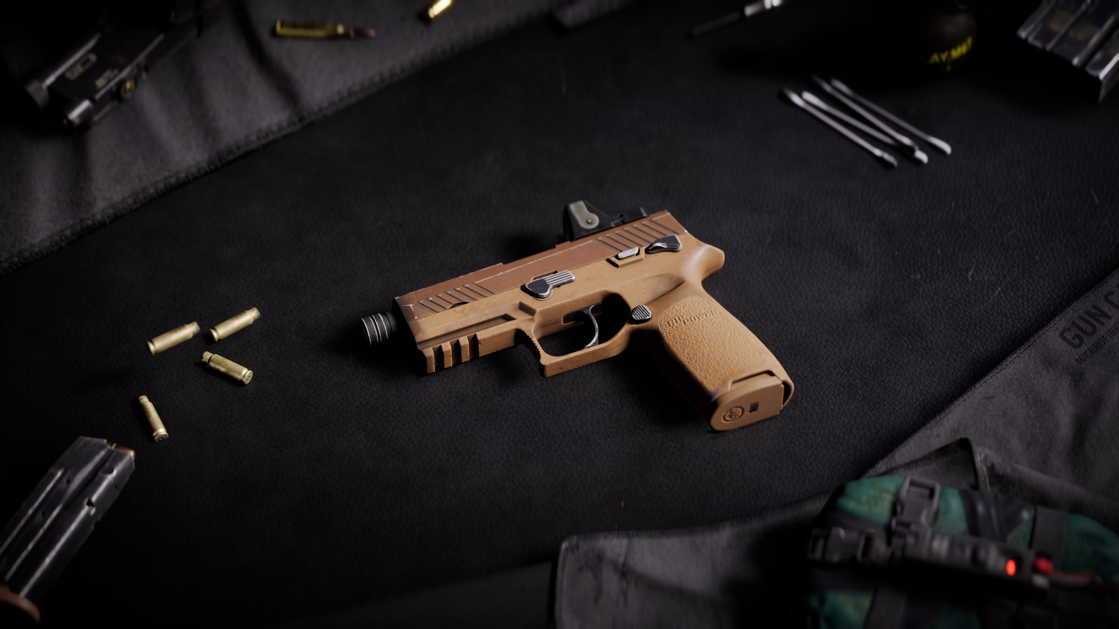 Light brown P18 sidearm is laid on a black surface surrounded by tools, ammo, and gun cleaning supplies.