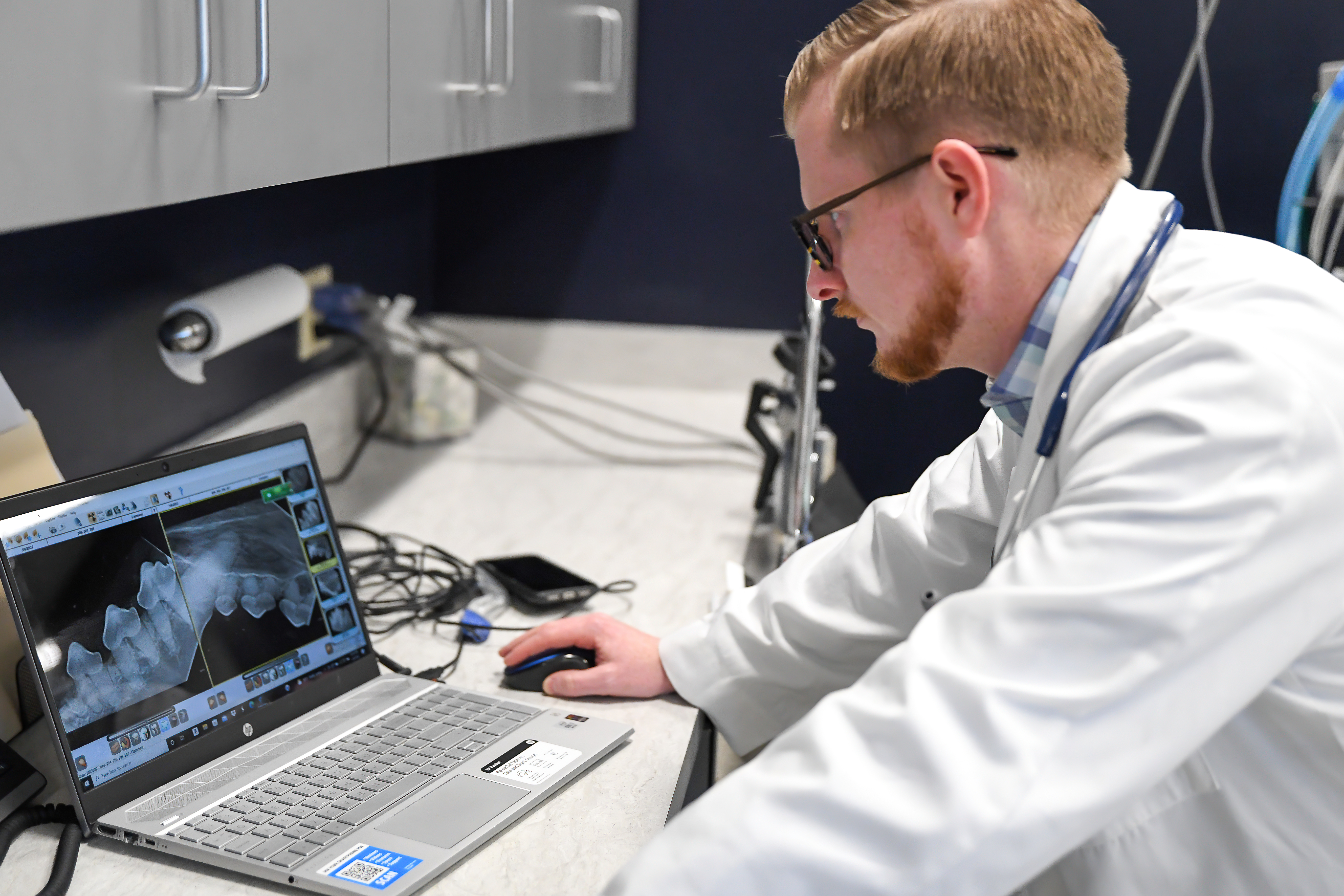 Doctor looking at a teeth x-ray