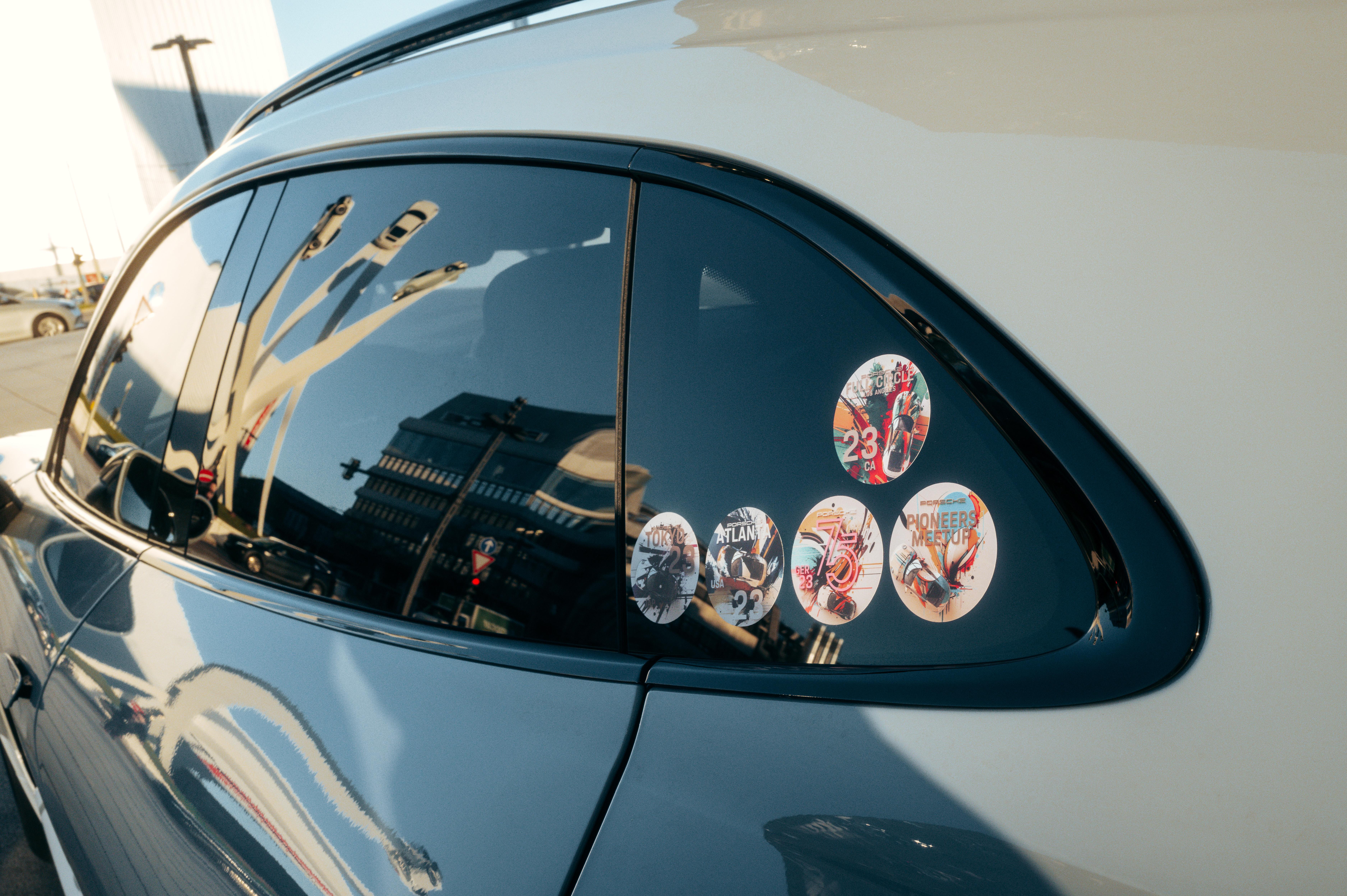 Taycan rear window showcasing unique PIONΞERS CIRCLE NFT stickers