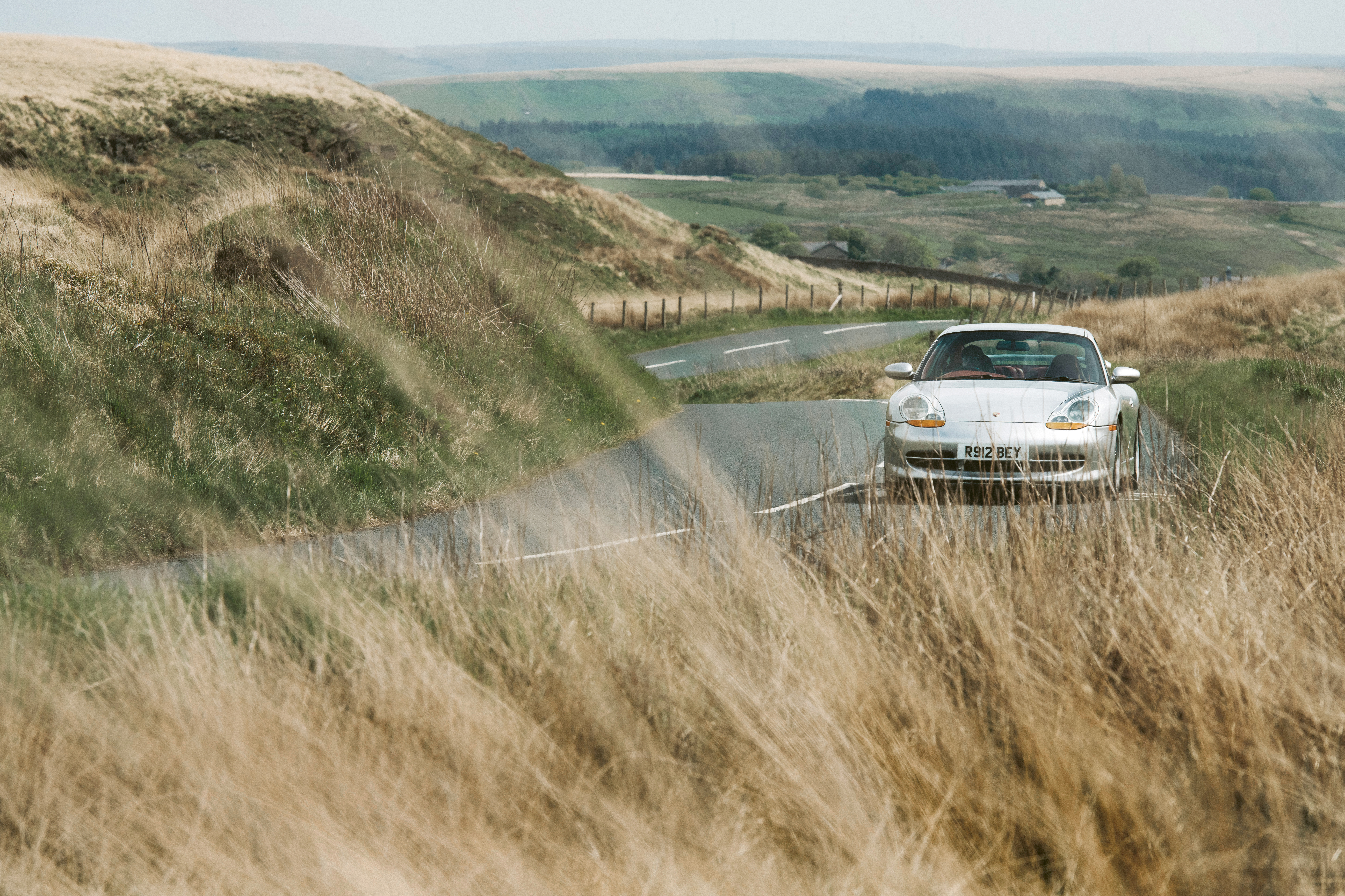 Arctic Silver Porsche 911 (996) driving through northern English countryside