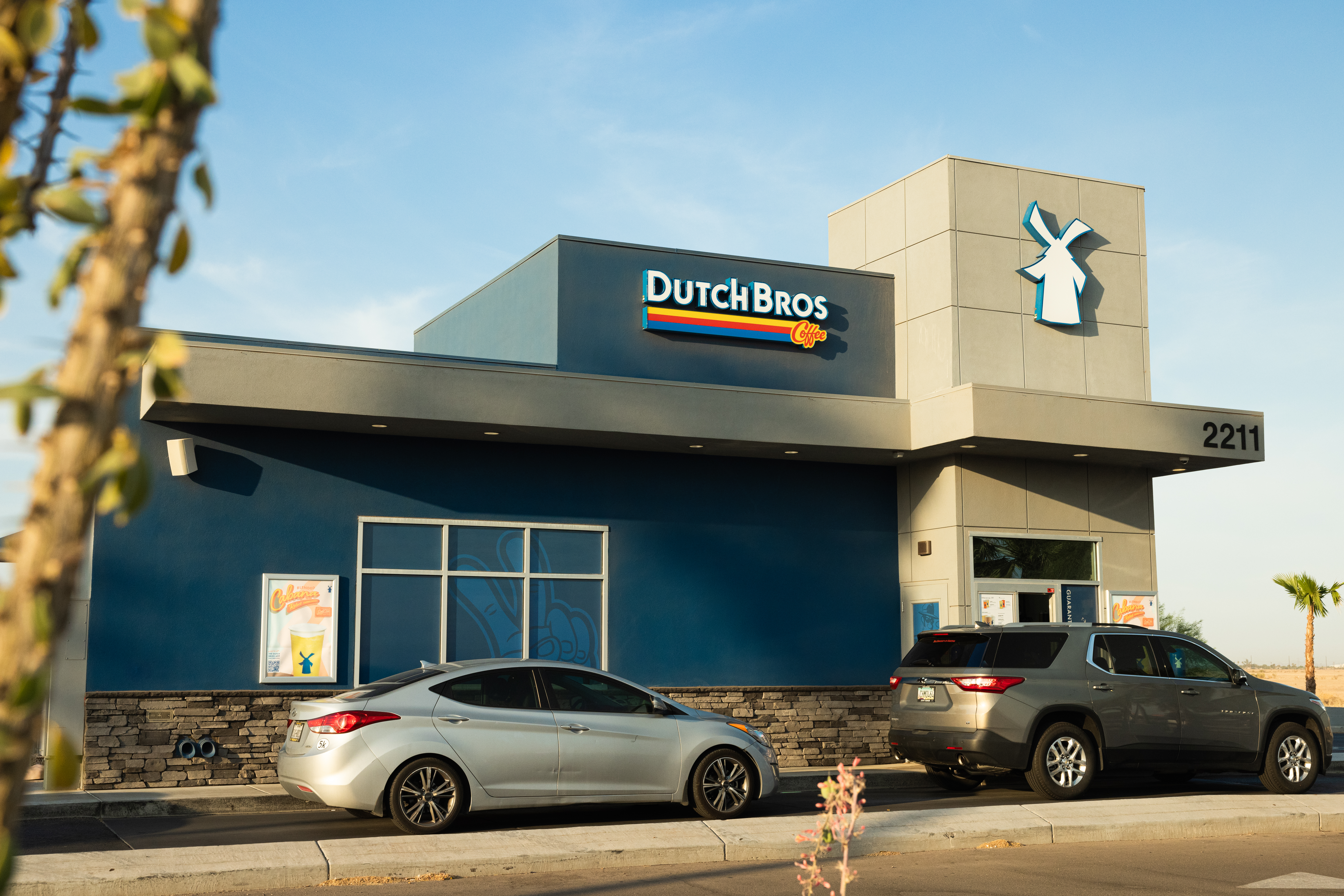 cars in line at a dutch bros drive thru location