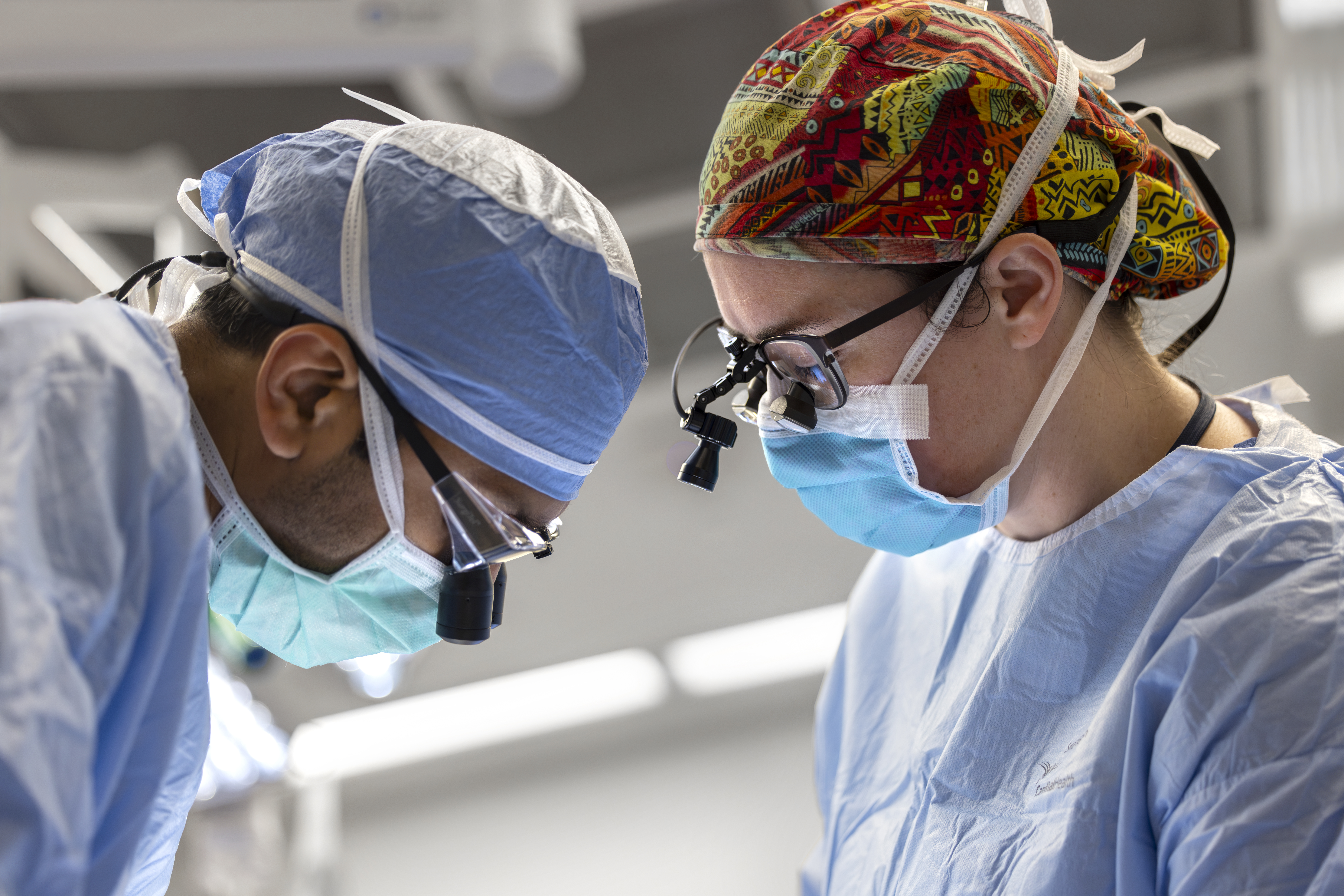 Drs. Emily Funk and Neerv Goyal in operating room.
