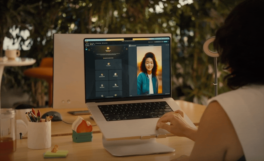 A video of a female developer sitting at her desk building a face Lens with Lens Studio