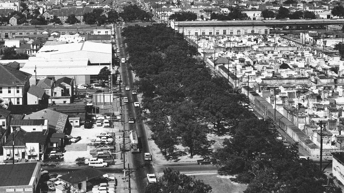 Aerial shot of oak-lined North Claiborne Avenue in New Orleans (1966) and the aftermath of the completed highway I-10 over North Claiborne Avenue.
