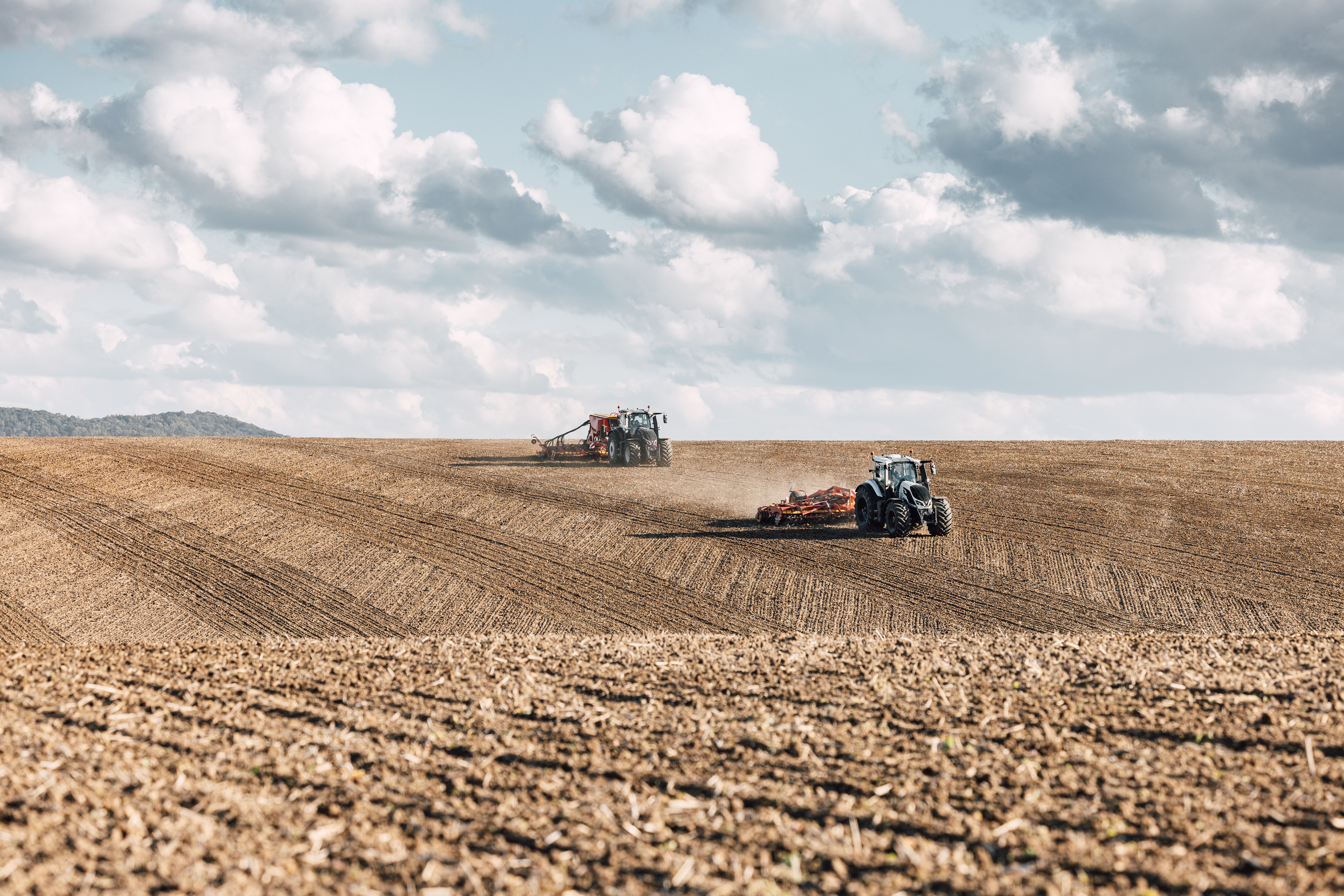 Valtra tractors working in a field