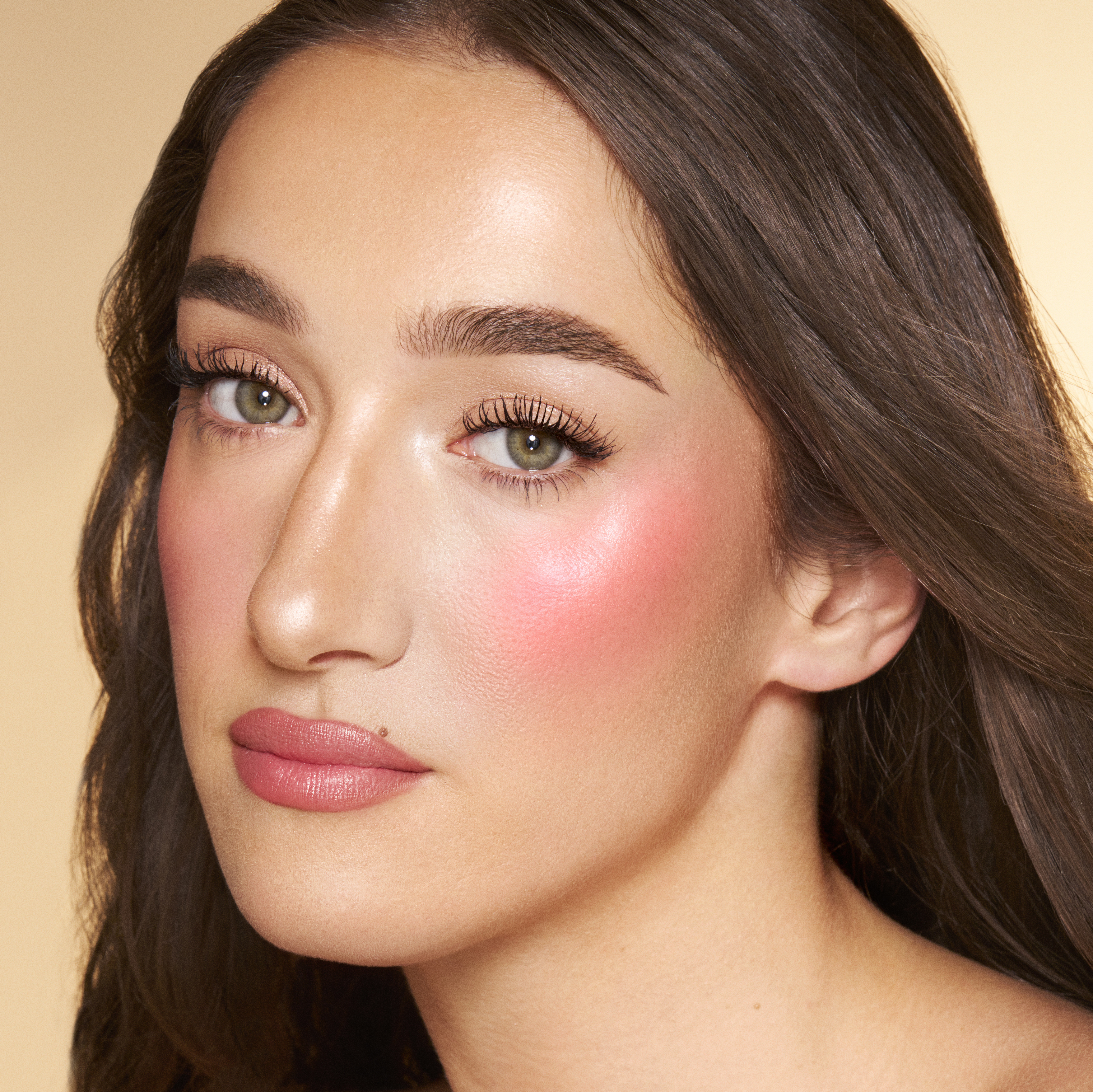 Bella wearing a bright pink summer blush look created with Paradise Pink Glow