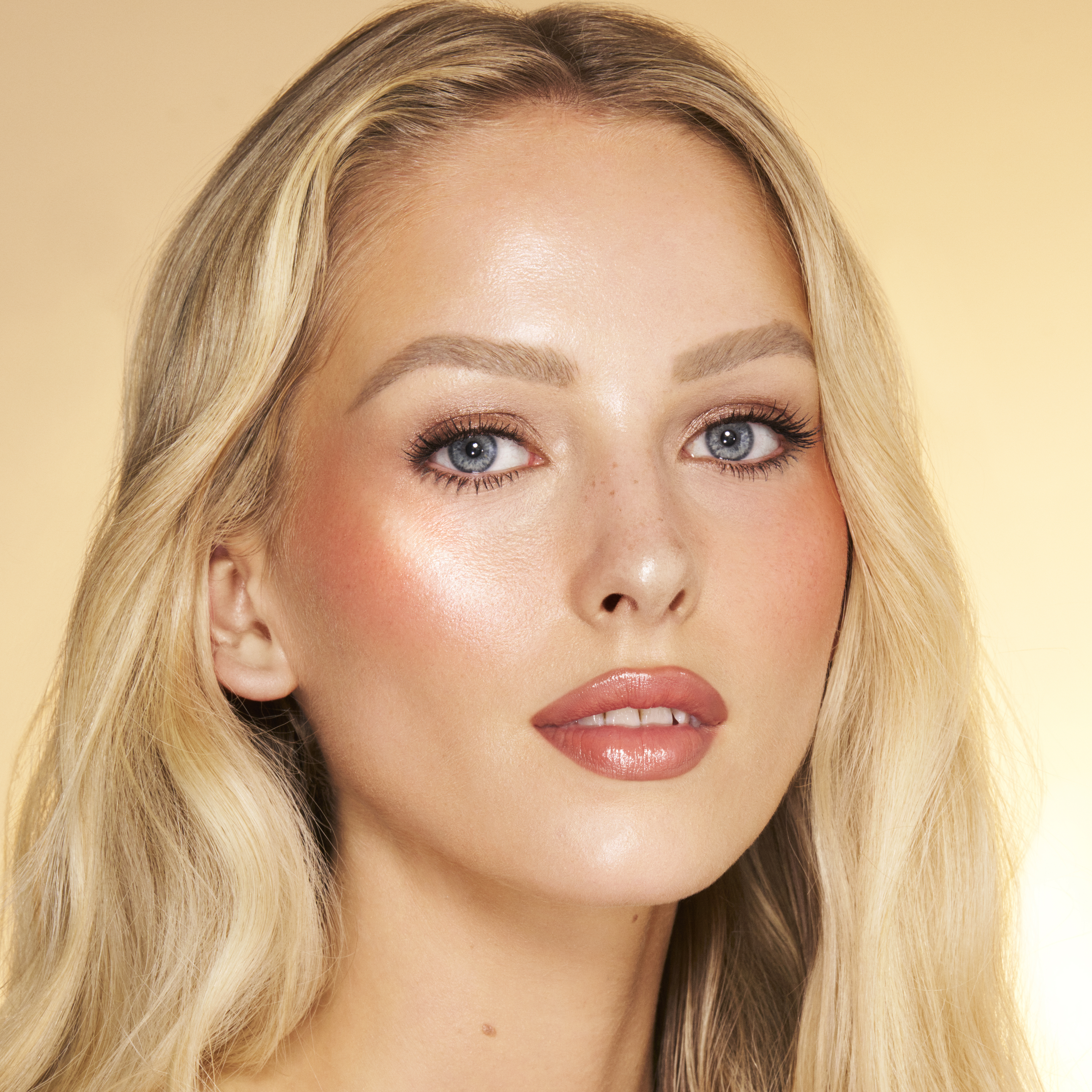 Model wearing a beach day summer blush look created with Beach Peach Glow