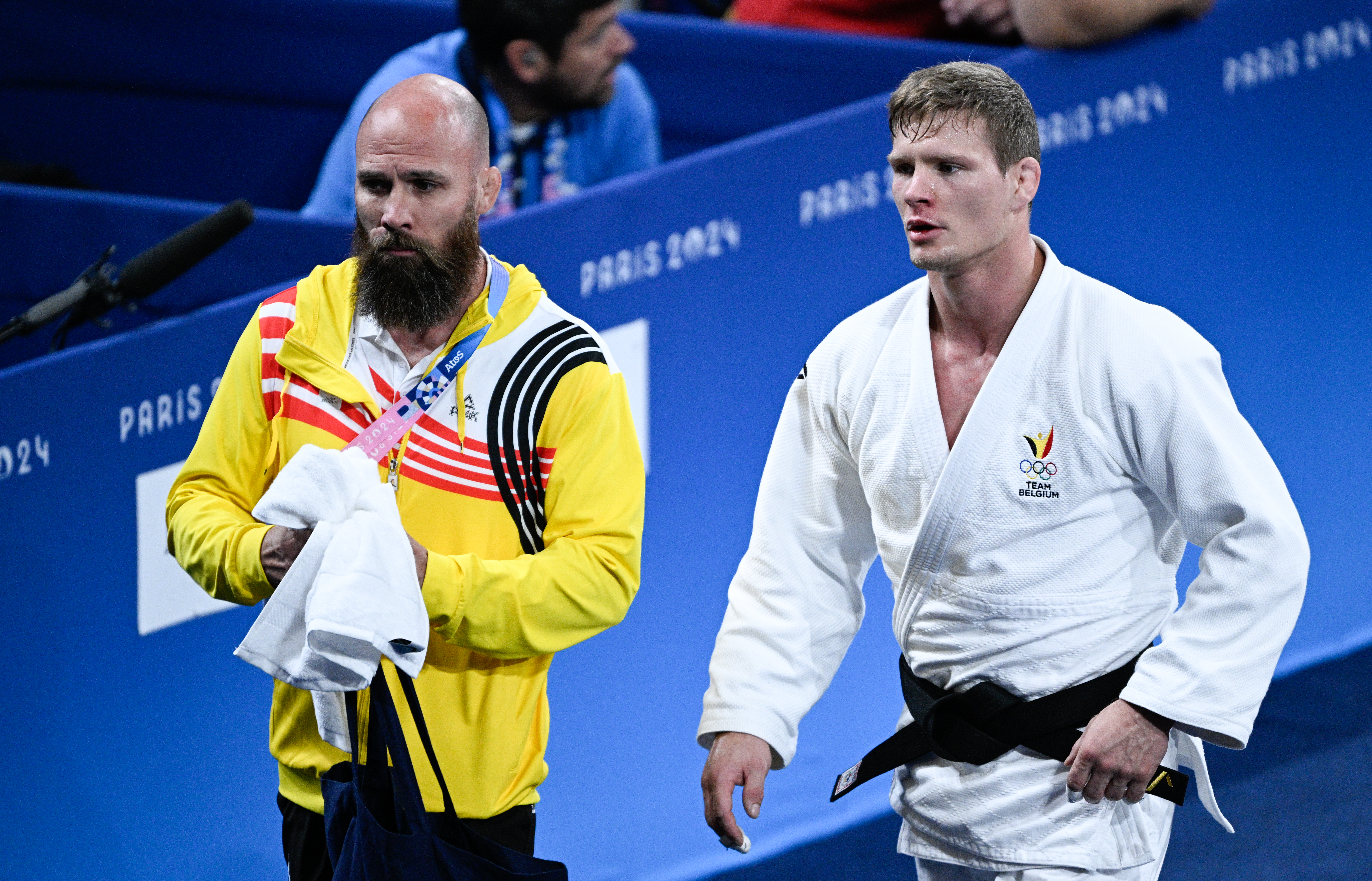 Belgian Matthias Casse celebrates with his coach Mark Van Der Ham after winning a judo bout against Hungarian Ungvari in the elimination round of 16 of the -81kg category of the men's judo competition at the Paris 2024 Olympic Games, on Tuesday 30 July 2024 in Paris, France. The Games of the XXXIII Olympiad are taking place in Paris from 26 July to 11 August. The Belgian delegation counts 165 athletes competing in 21 sports. BELGA PHOTO JASPER JACOBS