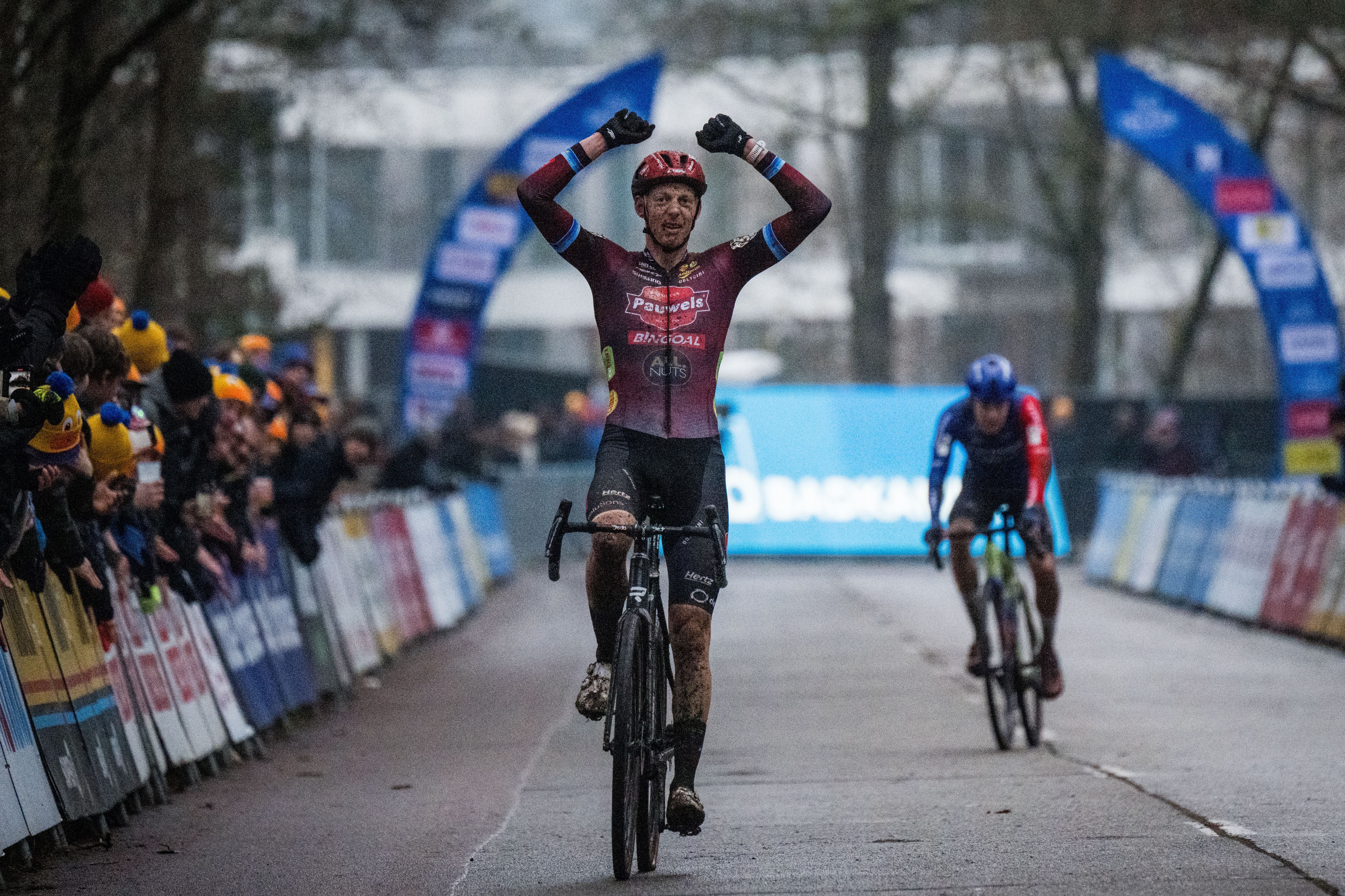 Belgian Michael Vanthourenhout celebrates as he crosses the finish line to win the men's elite race at the 'Herentals Crosst' cyclocross cycling event on Saturday 14 December 2024 in Herentals, stage 4/8 in the X2O Badkamers 'Trofee Veldrijden' competition. BELGA PHOTO JASPER JACOBS