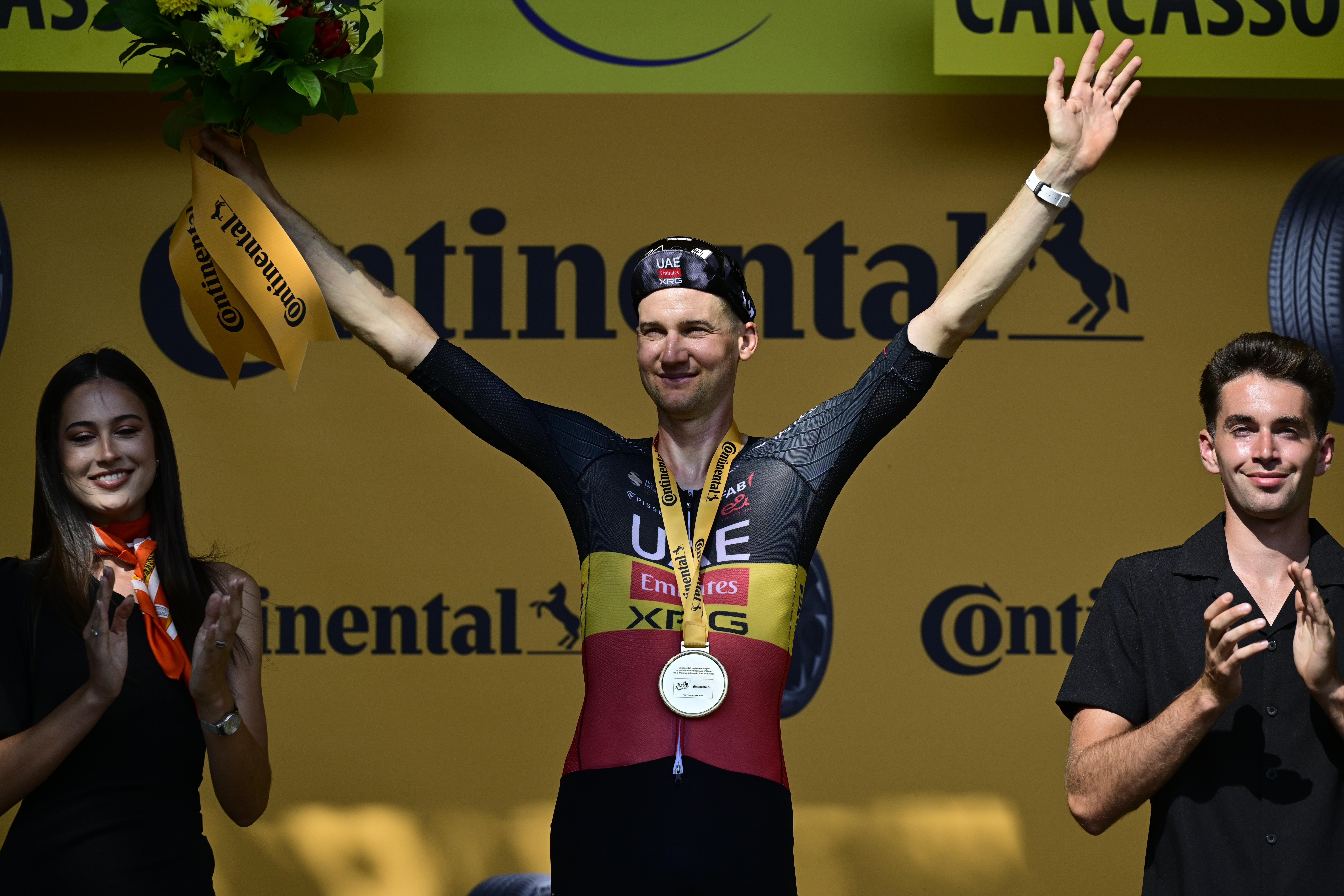 Belgian Tim Wellens of UAE Team Emirates and pictured on the podium after winning the stage 15 of the 2025 Tour de France cycling race, from Muret to Carcasonne (169 km), on Sunday 20 July 2025 in France. The 112th edition of the Tour de France starts on Saturday 5 July in Lille, France, and will finish in Paris, France on the 27th of July.   BELGA PHOTO DIRK WAEM